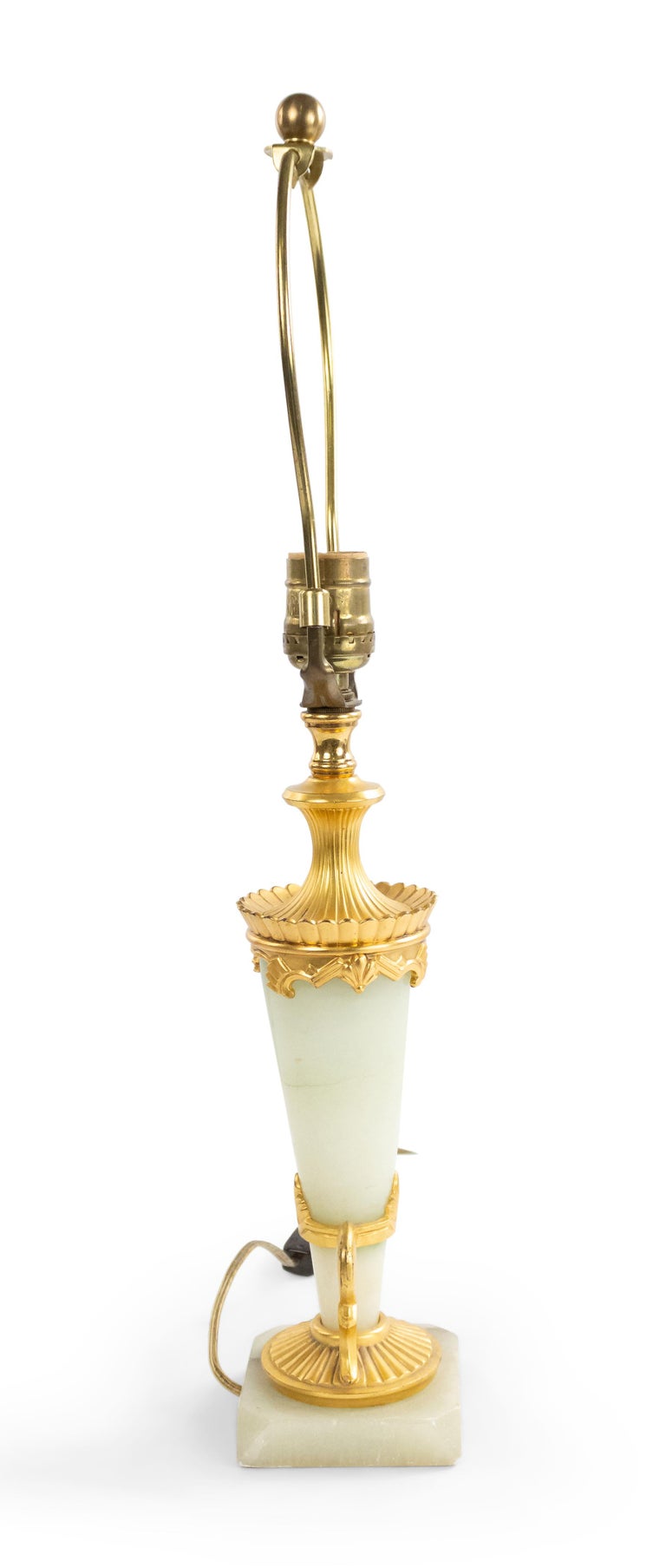 Art Deco French light green onyx lamp with a tapered cone form mounted with gilt bronze trim and resting on a square base.