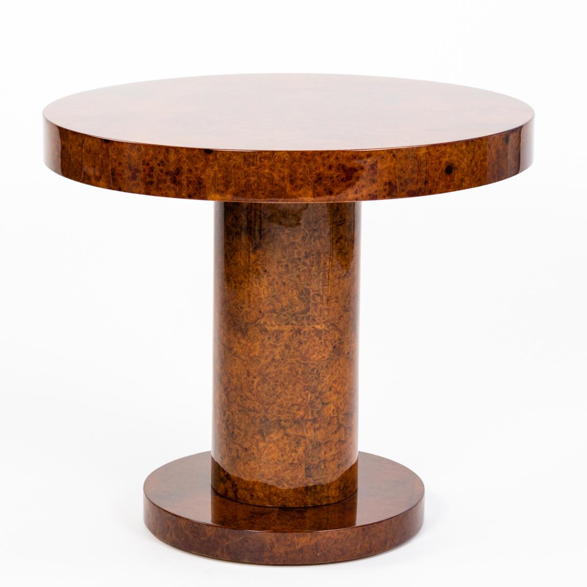 Round Art Déco Gueridon - coffee table in very high quality Amboyna Burl veneer - high gloss lacquer.
The puristic table lives from the exclusive Amboyna veneer, which is in a very good orignal condition.
The golden-brown veneer with red