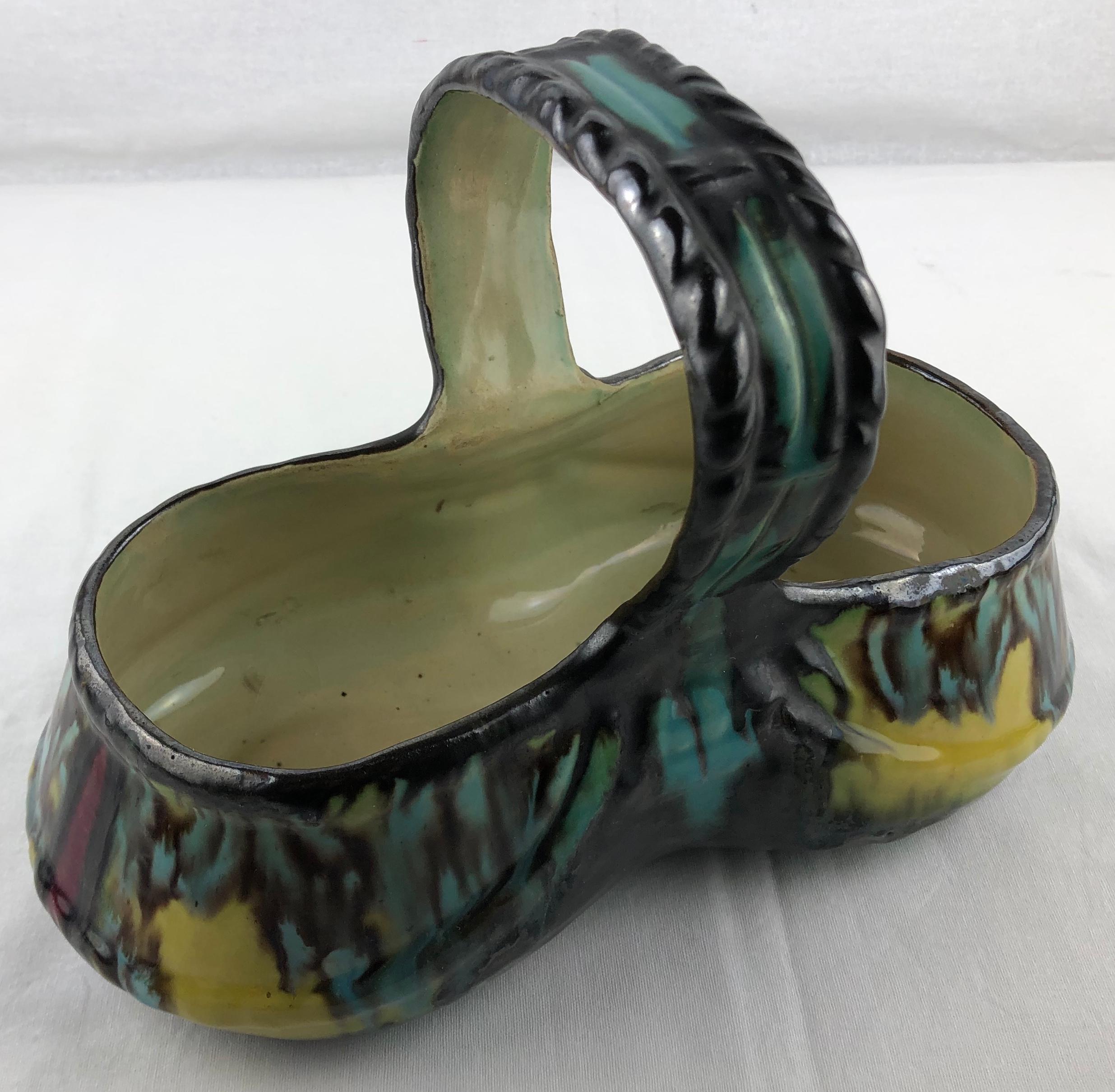 Stunning French Art Deco ceramic basket or bowl with handles, circa 1930. 
This beautiful decorative object is signed H D and numbered, it was handcrafted by Henri Delcourt a well known ceramic artist from Paris, France (Boulogne). 

Wonderful