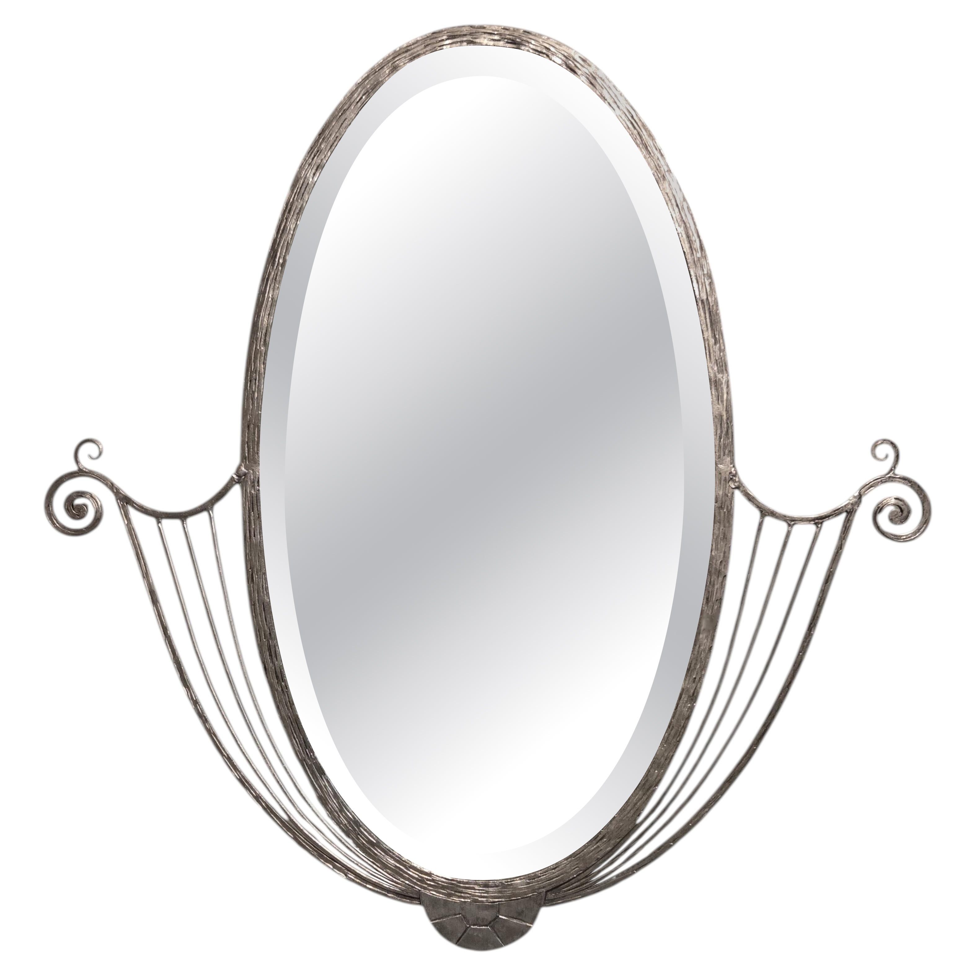 French Art Deco hand wrought nickeled iron oval mirror w/ linear & scroll detail
