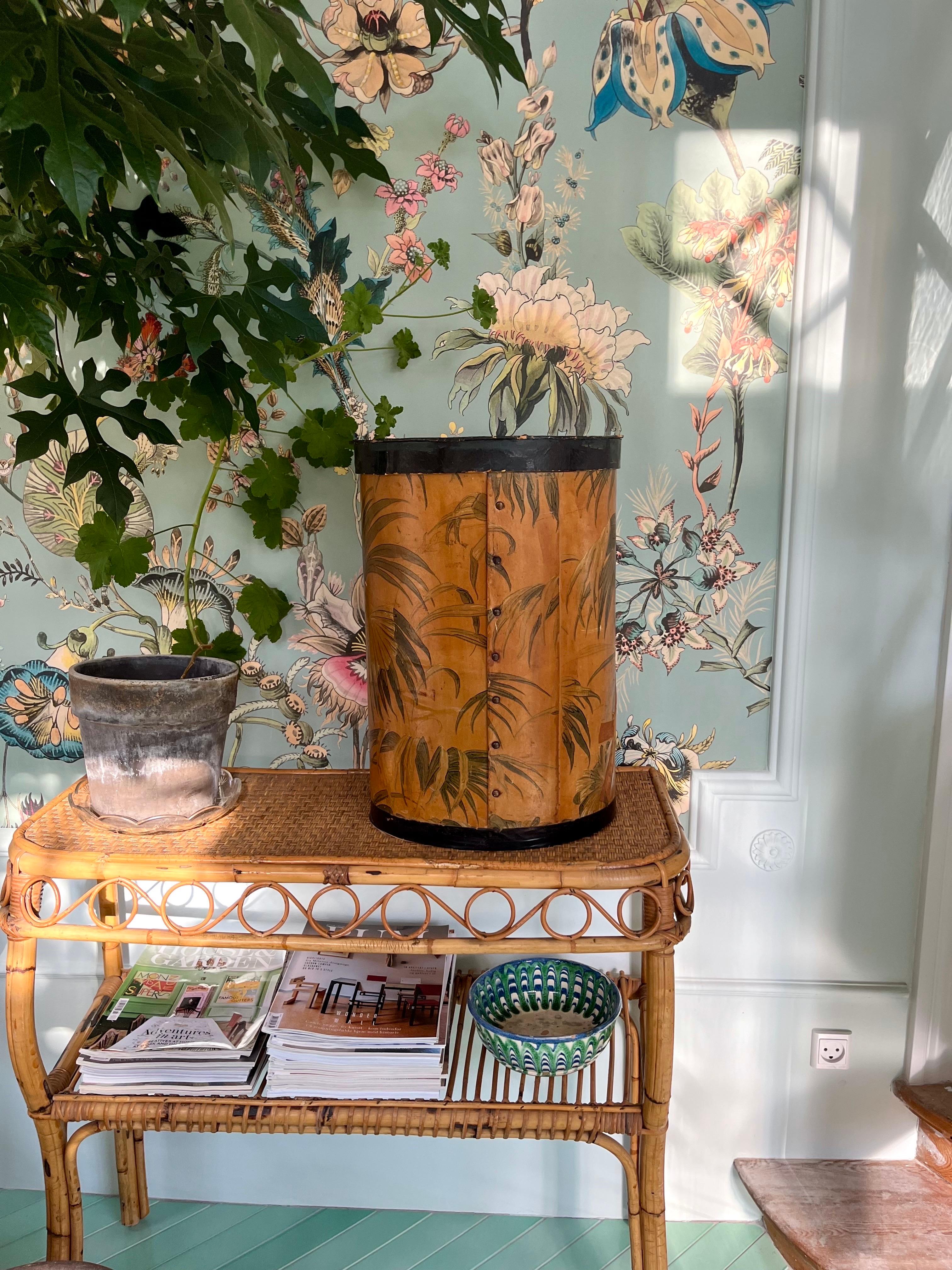 French Art Deco Hat Box with Exotic Leaf Motif, 1920s–1930s

Vintage French hat box, c. 1920s–1930s, in an elegant oval form. Crafted in sturdy cardboard and clad with coated decorative paper, the design features an exotic palm leaf pattern in warm