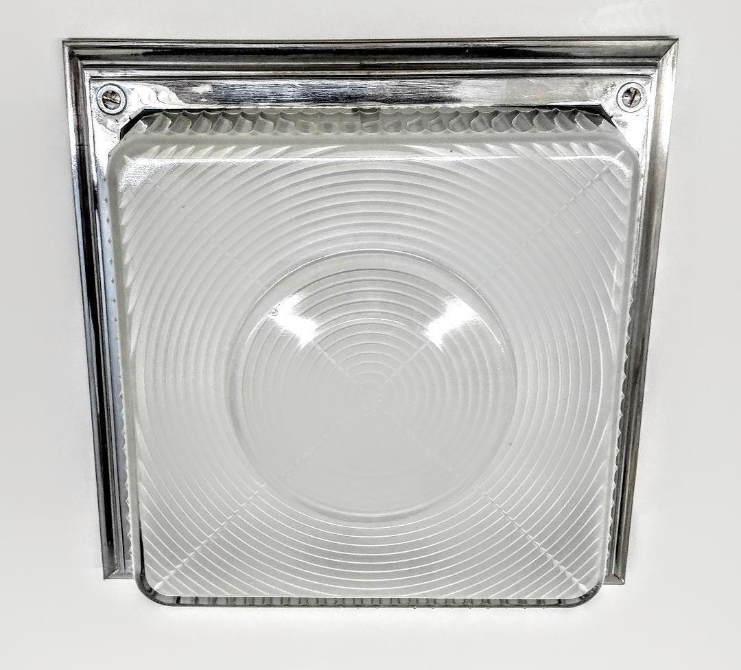 
French Art Deco Industrial Design square shaped flush mount. Has a two-tiered spiked motif in clear frosted glass with polished details. The glass is mounted in its original finish polished nickel-plated Bronze frame. The fixture has been rewired