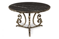 French Art Deco Iron and Black Marble Circular Scoll Form Center Table