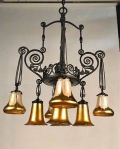 French Art Deco Iron Eight-Light Chandelier with Quezal Shades