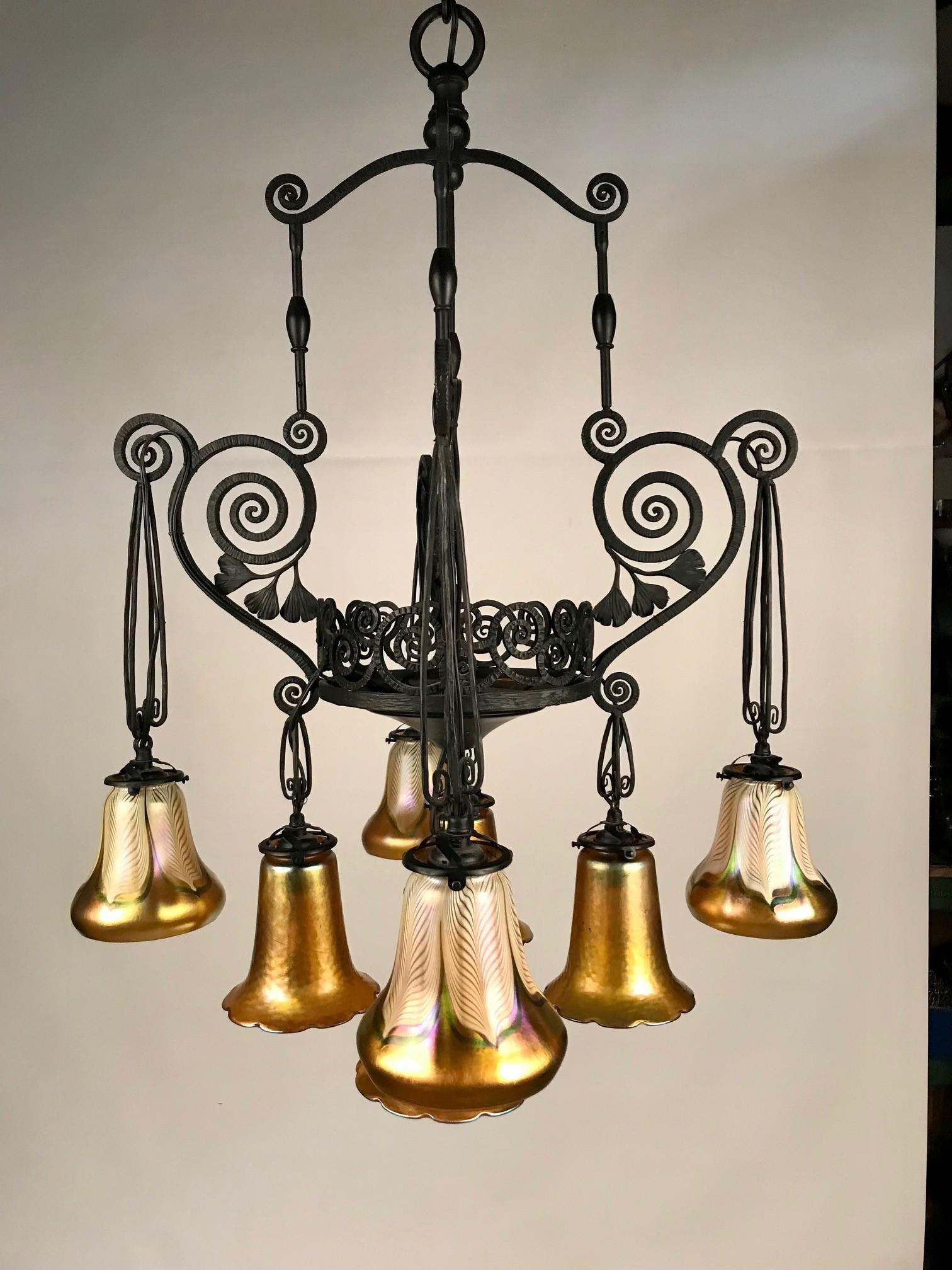 Hammered French Art Deco Iron Eight-Light Chandelier with Quezal Shades