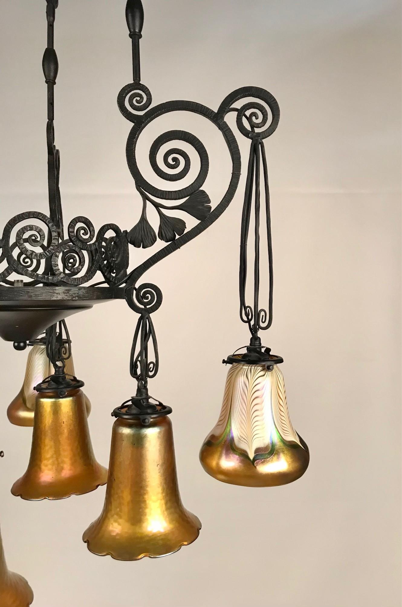 French Art Deco Iron Eight-Light Chandelier with Quezal Shades 1
