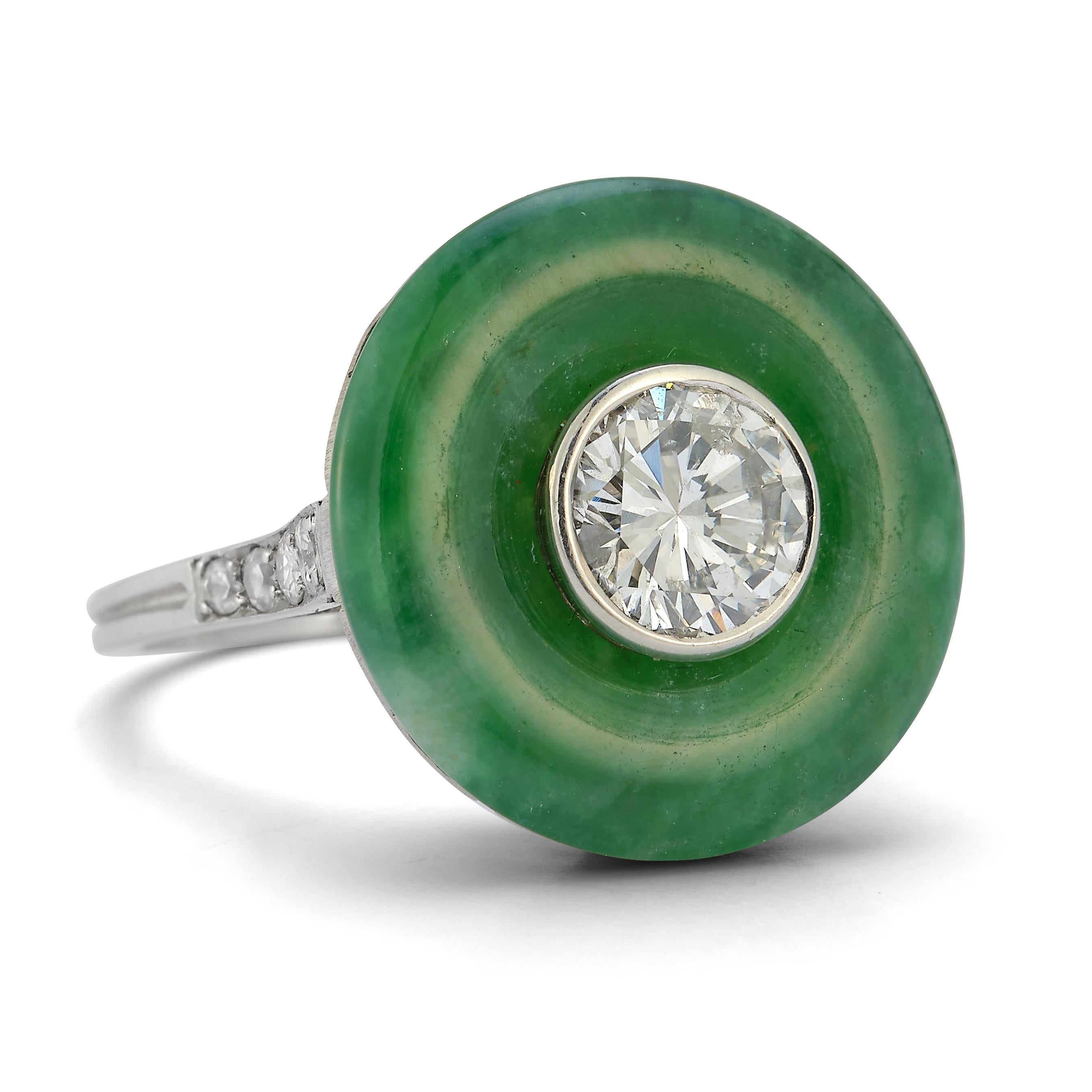 French Art Deco Jade Diamond Ring

Center Diamond approx 1.02 ct

Set in Platinum. French Stamp

Made In France Circa 1925

Sizable to any size
