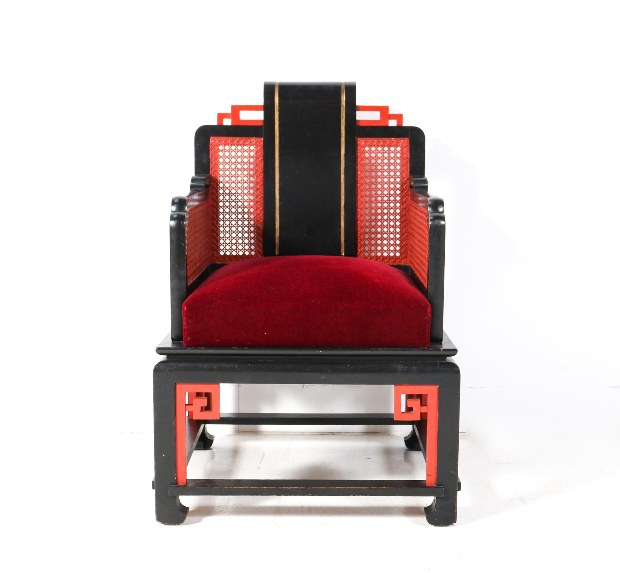 Stunning and rare Art Deco Japonisme armchair.
Striking French design from the 1930s.
Original lacquered beech frame with original hand-painted wicker back and armrests.
Seat has been re-upholstered in red velvet  by the former owner.
This wonderful