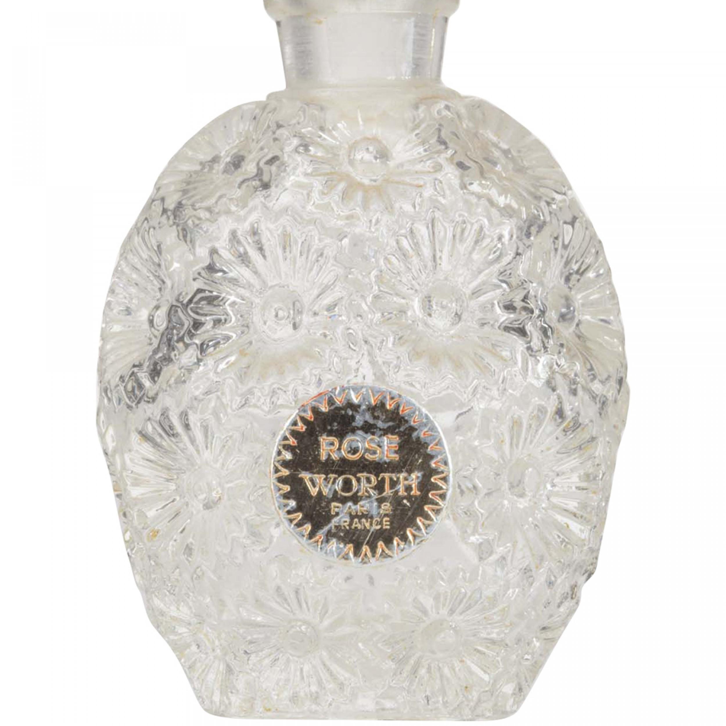 French Art Deco oval-shaped glass perfume bottle with indented daisies molded into the body and a matching stopper (signed LALIQUE)