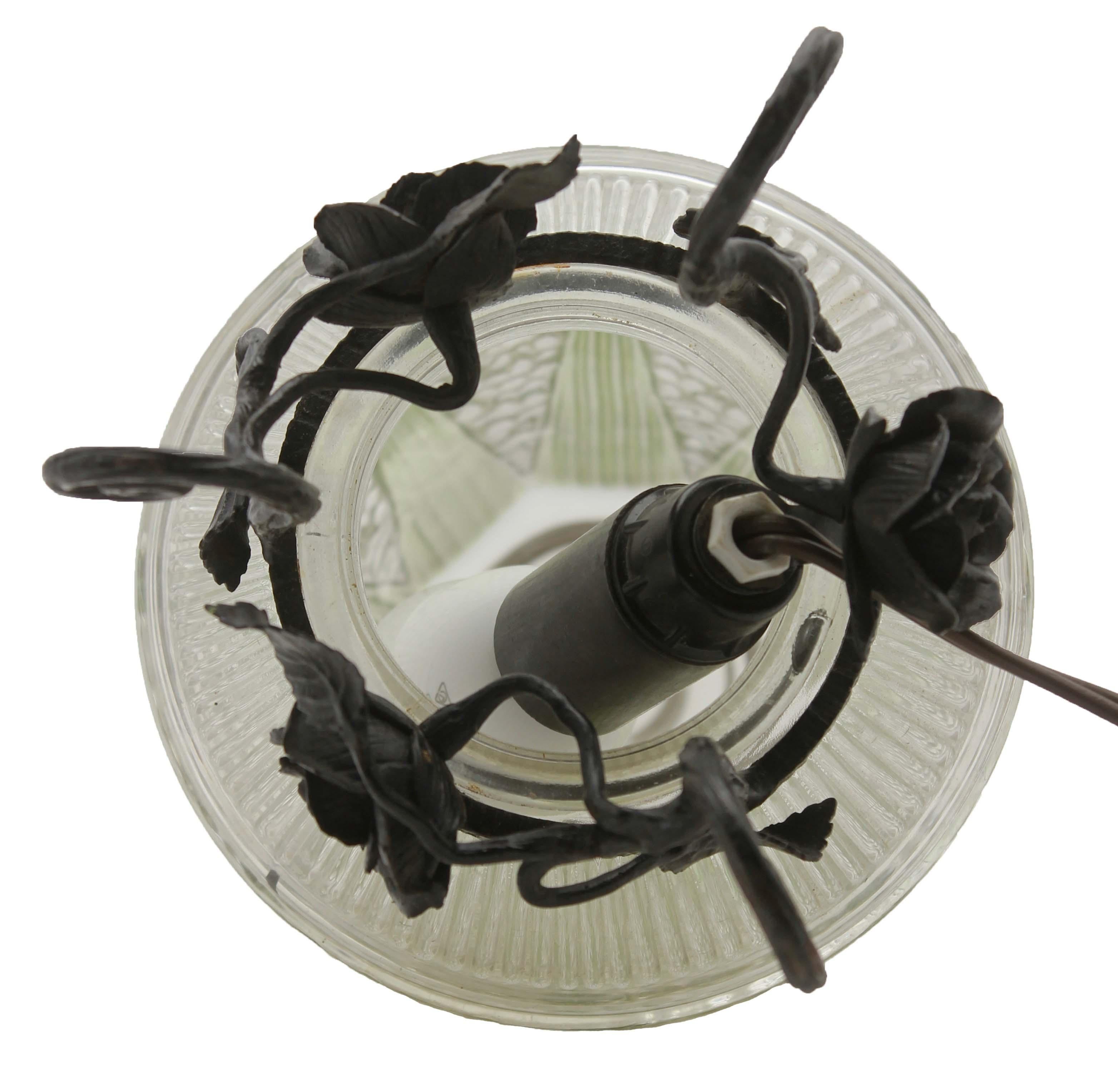 Early 20th Century French Art Deco Lamp in Wrought Iron with Floral Pattern and Colored Glass Shade