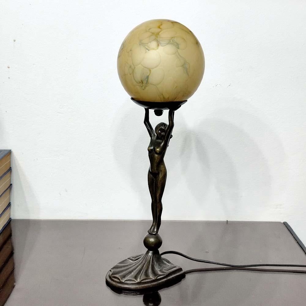 woman holding globe lamp