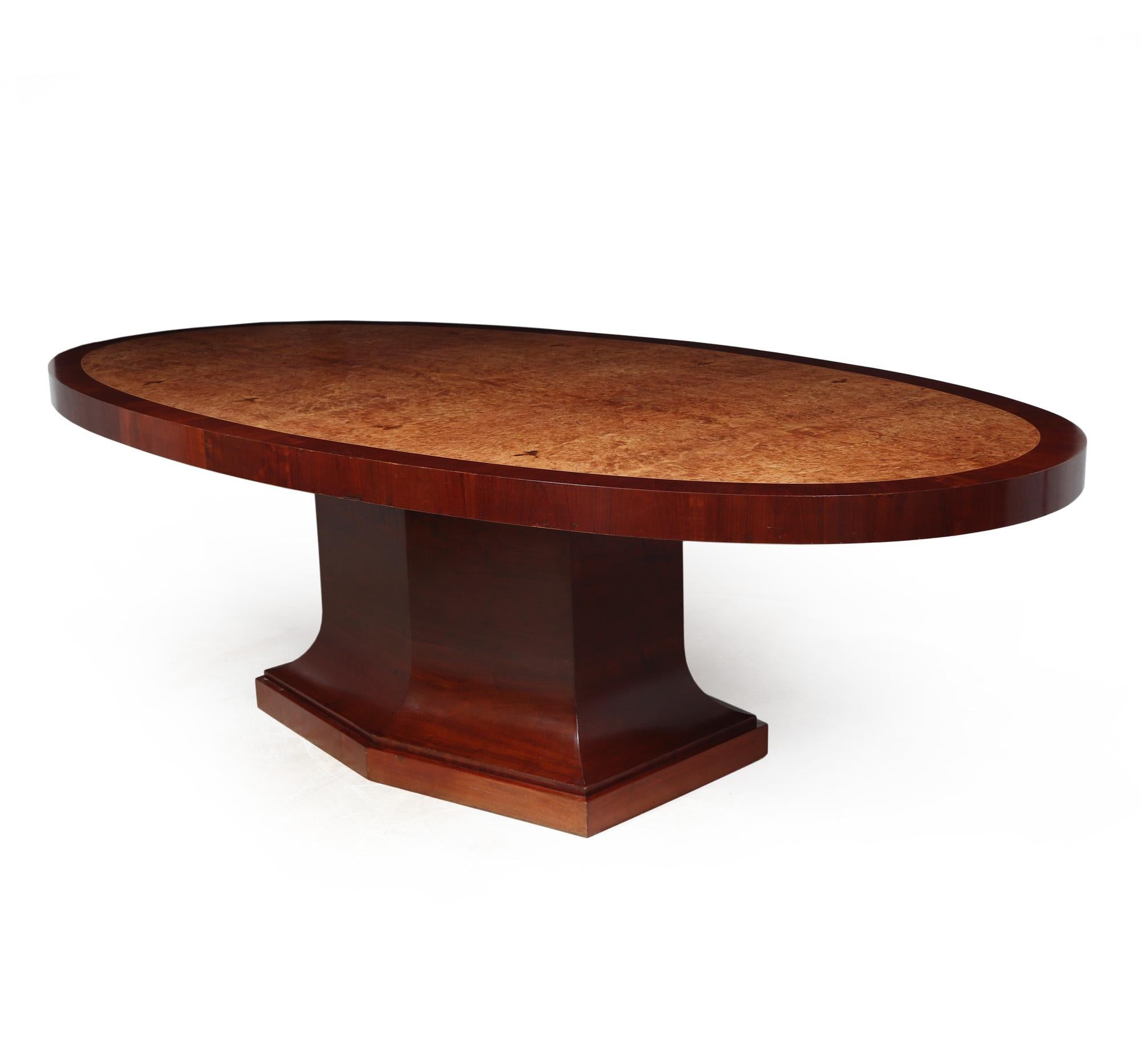 FRENCH ART DECO TABLE
A large 8 seat dining table produced in France in the Art Deco period, having lovely tight burr maple with contrasting mahogany cross banding and standing on a substantial central 6 sided pedestal base, the table has been
