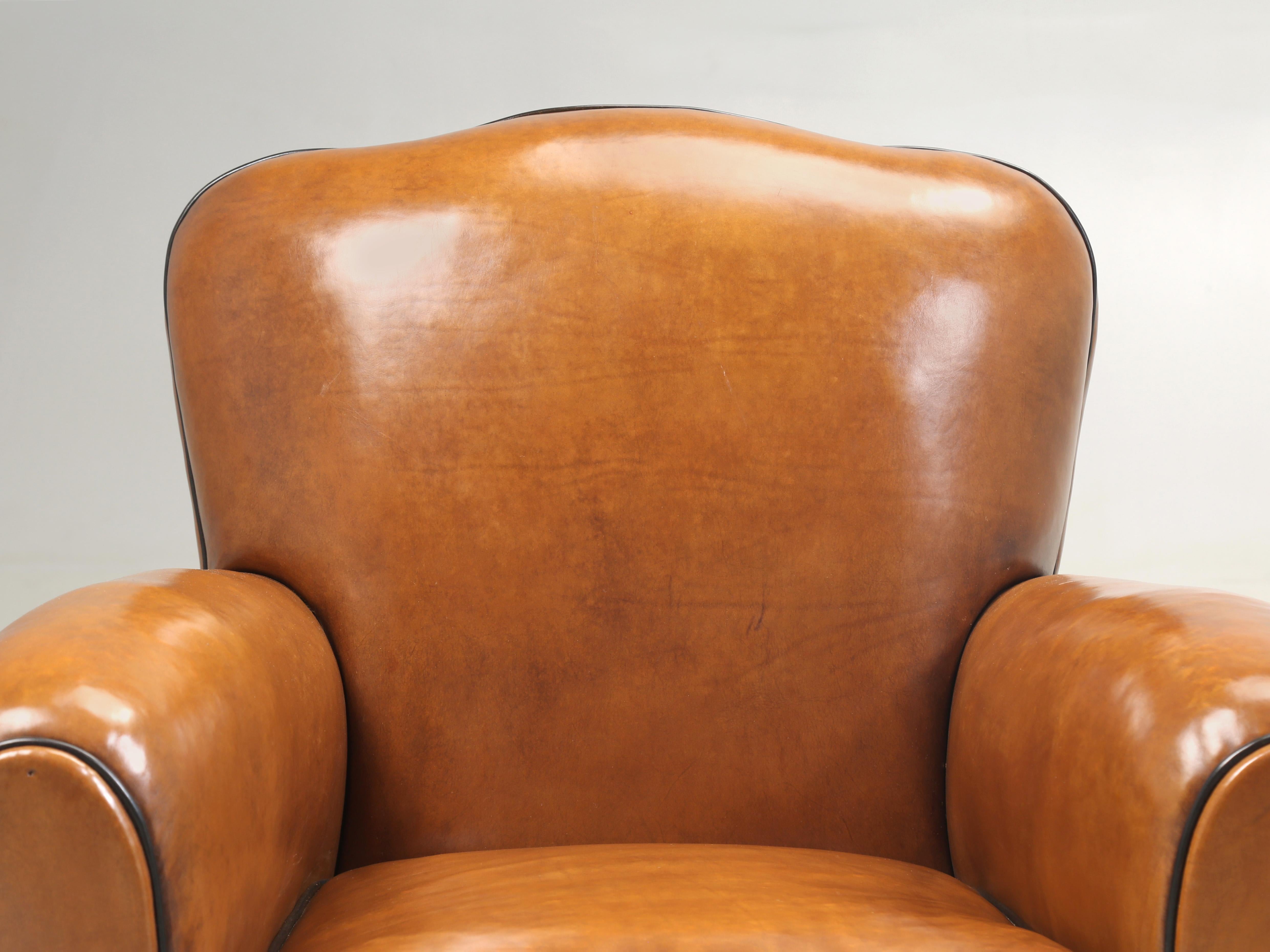 An Original 1930's French Leather Art Deco Club Chair that our Old Plank Upholstery Department painstakingly disassembled to the bare wood frame and rebuilt from the bottom up. Included in the restoration process was; 8-way hand-tied coil springs,