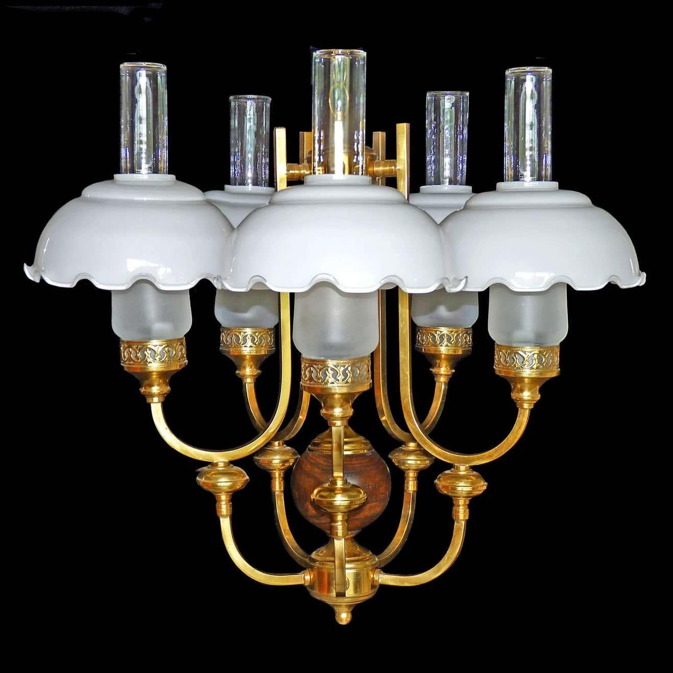 Gorgeous French Art Deco in Colonial style chandelier, gilt brass, wood and opaline glass shades
Measures:
Diameter 24 in / 60 cm
Height 36 in (20 in +12 in/chain) / 90 cm (60 cm + 30 cm/chain)
Glass shades 8 in /21 cm
Five light bulbs