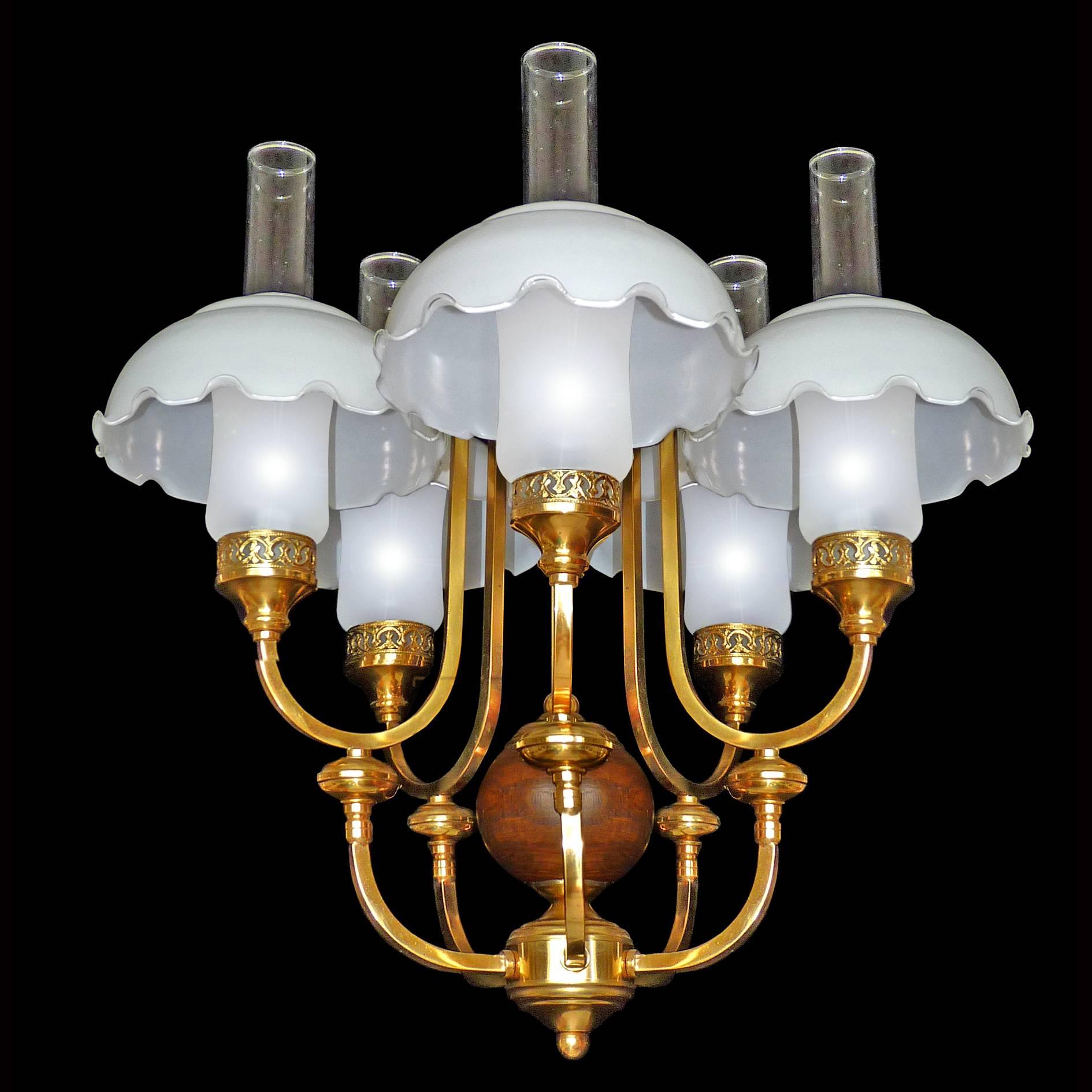 Gorgeous French Art Deco in Colonial style chandelier, gilt brass, wood and opaline glass shades
Measures:
Diameter 24 in / 60 cm
Height 36 in (20 in +12 in/chain) / 90 cm (60 cm + 30 cm/chain)
Glass shades 8 in /21 cm
Five light bulbs E14
Good