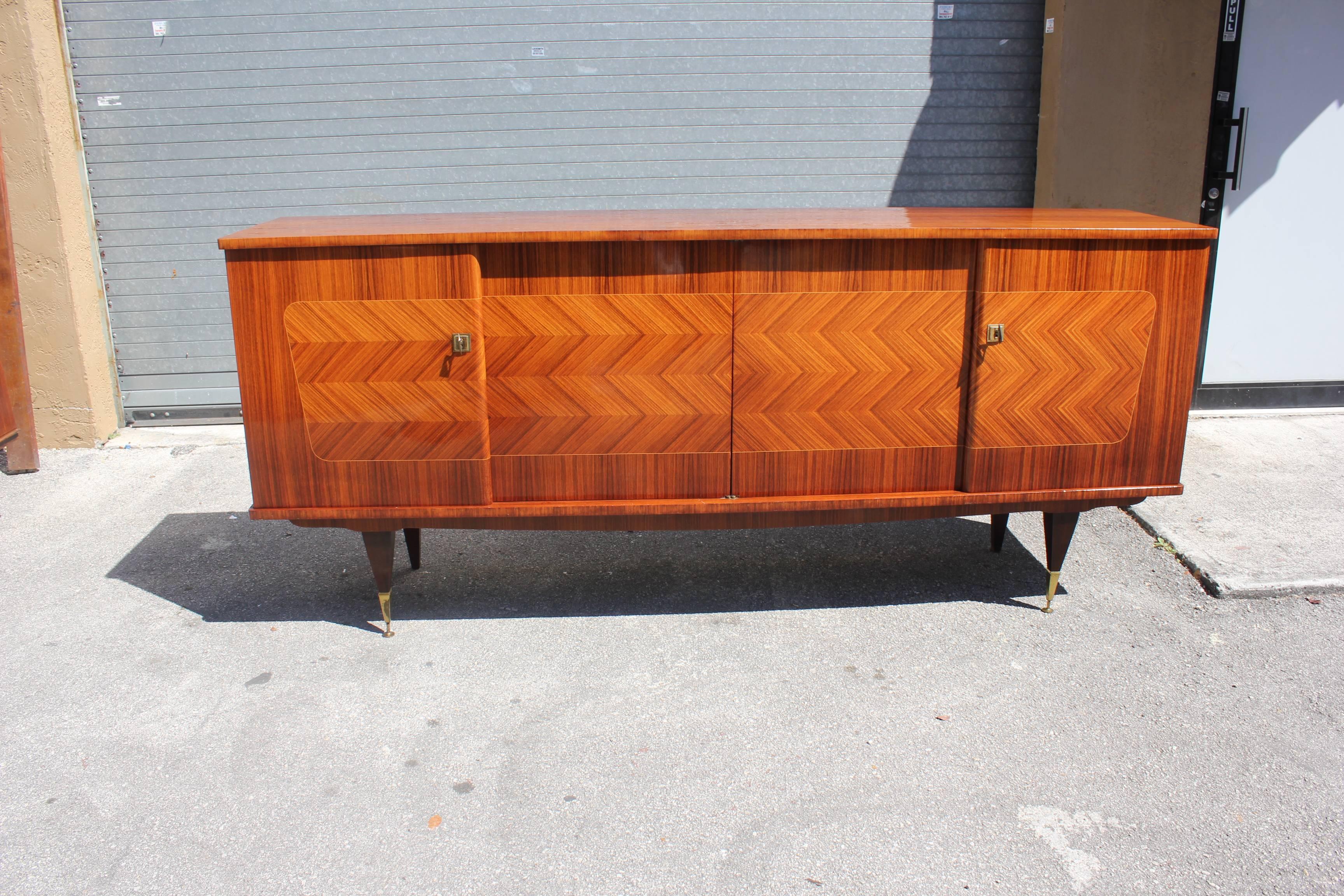 French Art Deco light exotic Macassar ebony''ZIG ZAG''sideboard or buffet in perfect condition, circa 1940s . With two drawers inside and all four shelves adjustable , and you can remove the shelves if you need more space ,beautiful bronze hardware