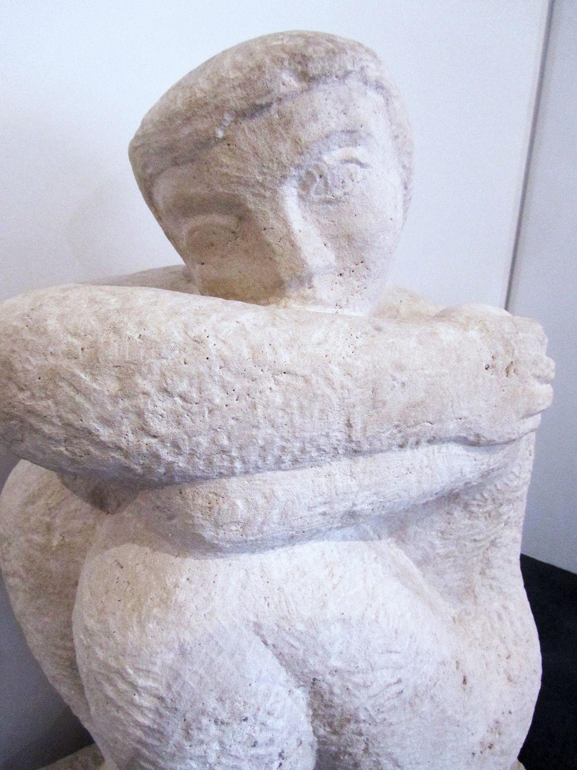 French Art Deco Limestone Figural Sculpture of a seated crouching male figure, finly cared in a solid block, Luciene gibert