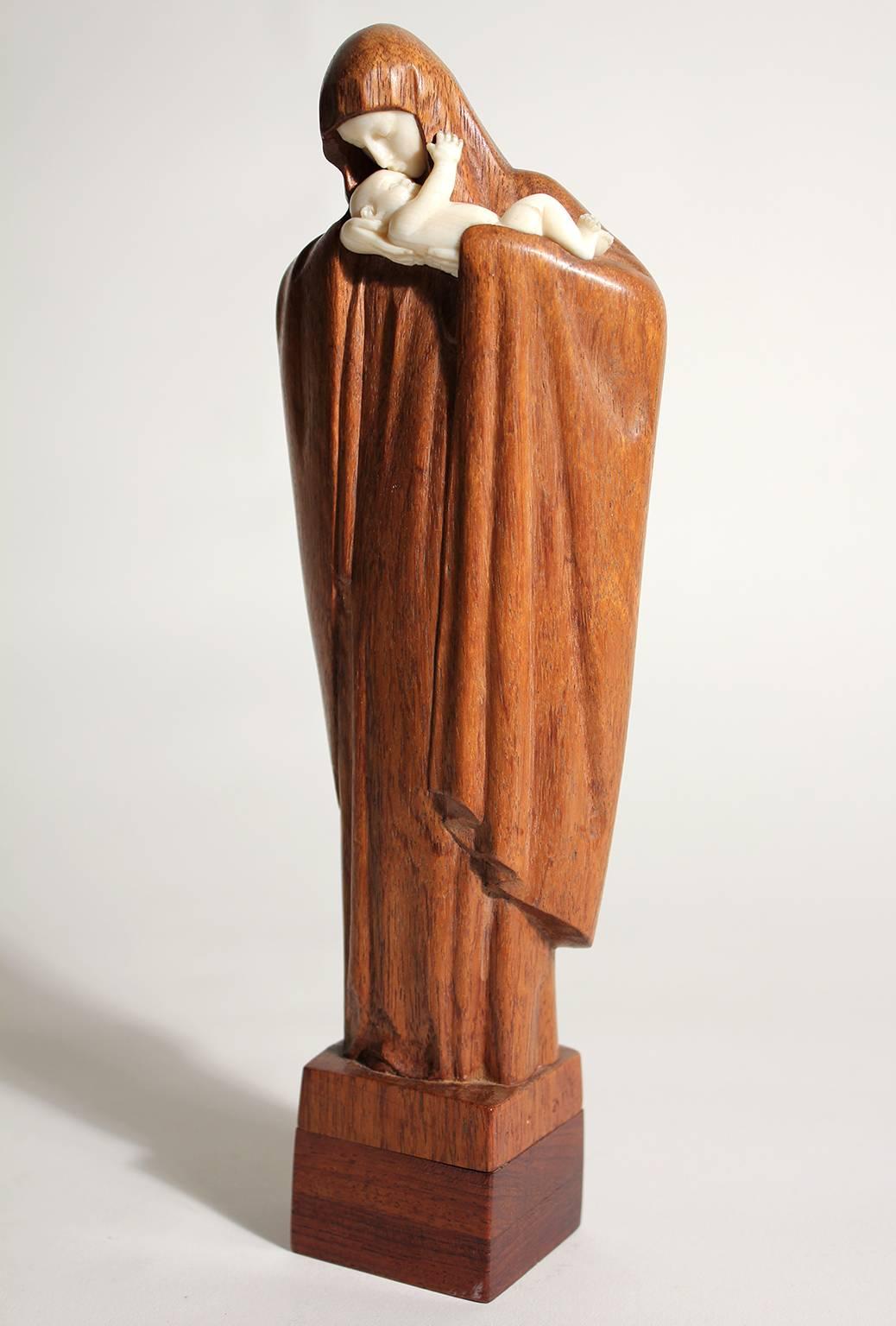 Exquisite French art deco sculpture by listed artist Lucienne Heuvelmans. The sculpture is carved out of wood and chryselephantine. Signed by the artist on the bottom. Excellent quality and detail.
