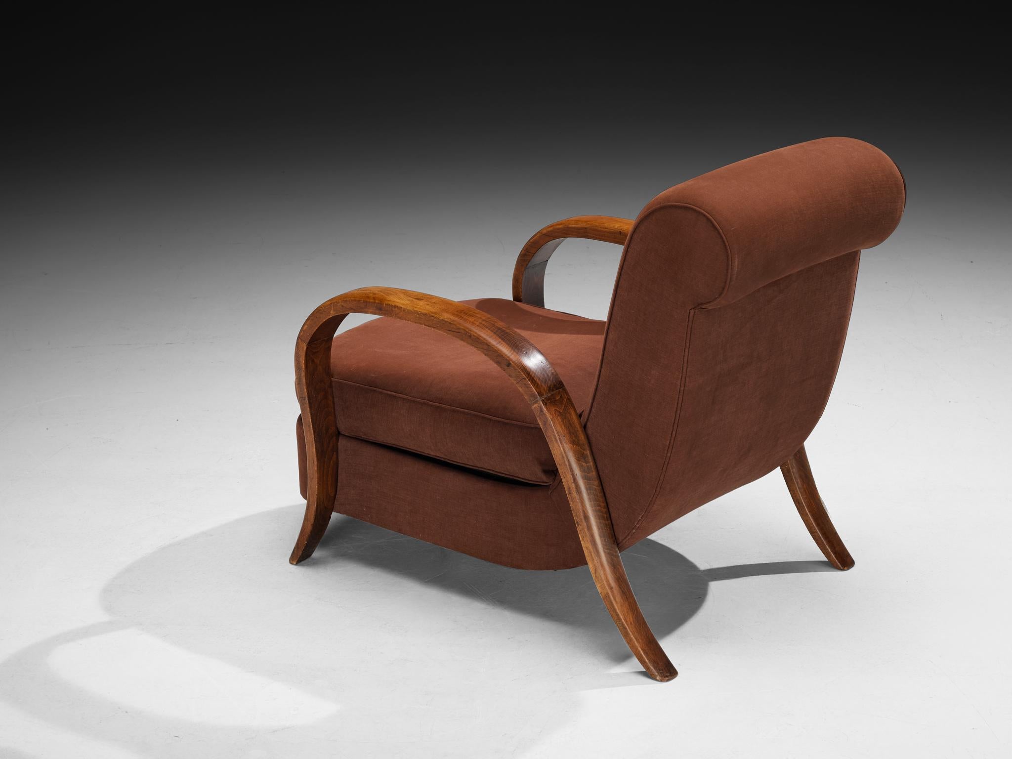 Lounge chair, beech, fabric, France, 1940s

A lovely French lounge chair from the late Art Deco period, showcasing elegant, rounded shapes and distinctive design elements. The armrests feature gracefully arched wood, enhancing their refined