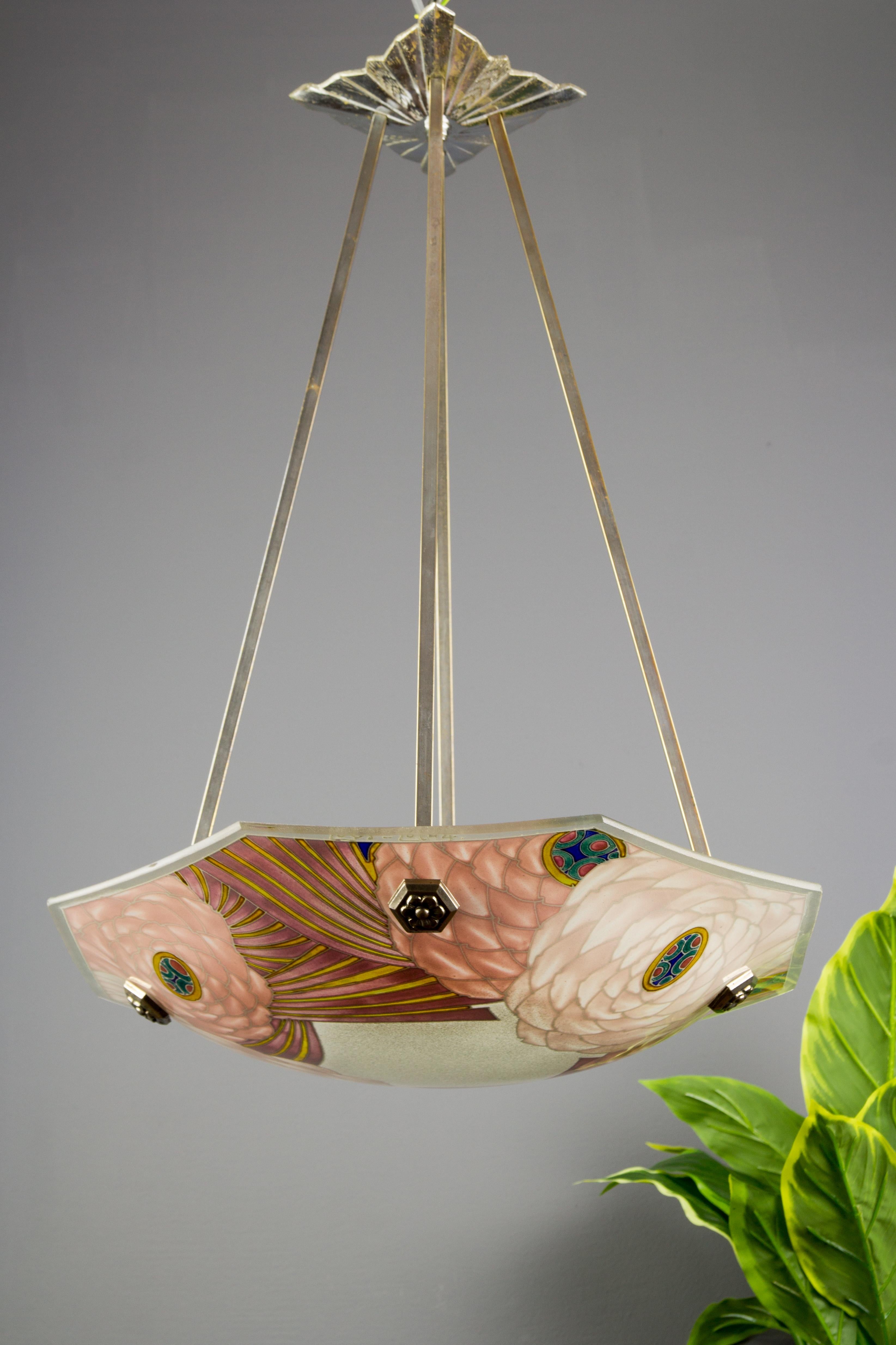 This superb Art Deco molded, frosted and hand painted hexagonal glass bowl features floral design in soft pastels that looks wonderful both lit and unlit. Outer edge is signed “Loys Lucha” by Les Verreries d'Art de Loys Lucha. The colorful pendant