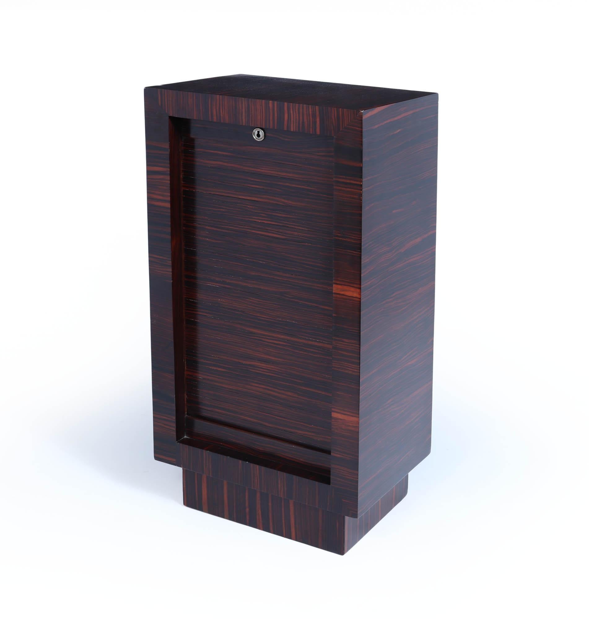 French Art Deco Filing cabinet
A very rare French Art Deco roller shutter filing cabinet in Macassar ebony having lockable shutter with original key six oak slide drawers, the cabinet has been fully polished by hand and in excellent condition