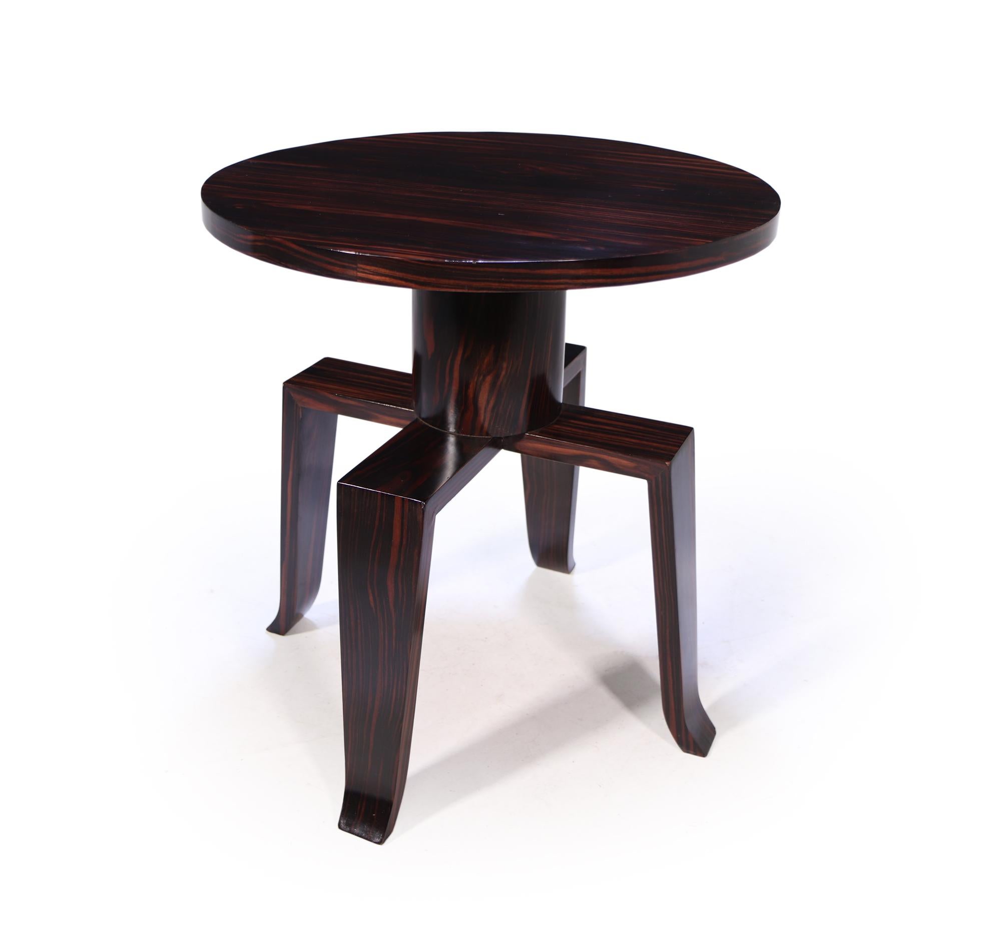 A very unusual piece of Art Deco having four legs splayed at the bottom, cone center column with a circular top all in macassar ebony with excellent grain and colour, the table has been restored where necessary and fully polished by hand

Age: