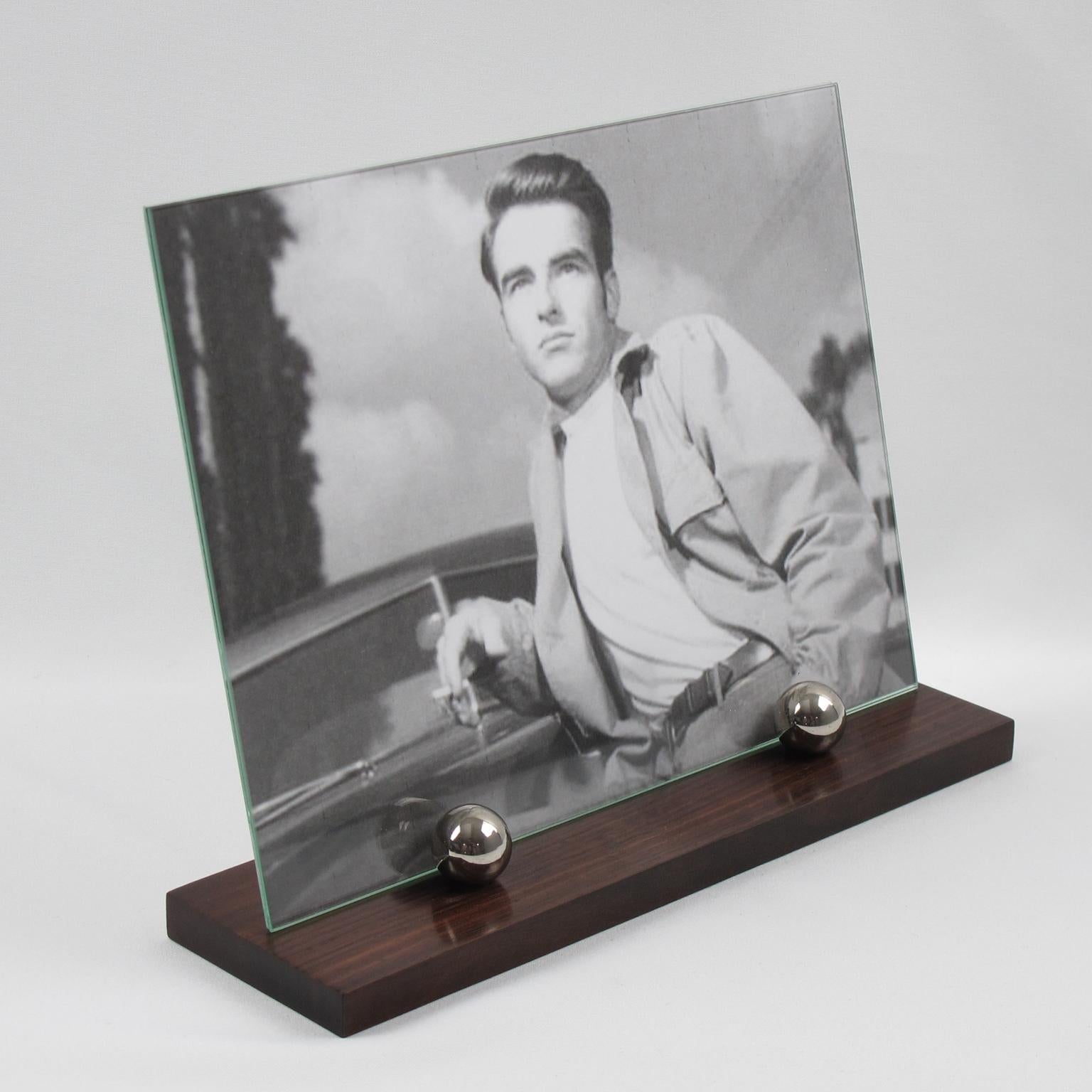 Elegant French Art Deco picture photo frame. Featuring thick hand-rubbed Macassar wood plinth complimented with two polished chrome metal balls. The frame is complete with its two glass sheets to enclose the photograph. The picture can be placed in
