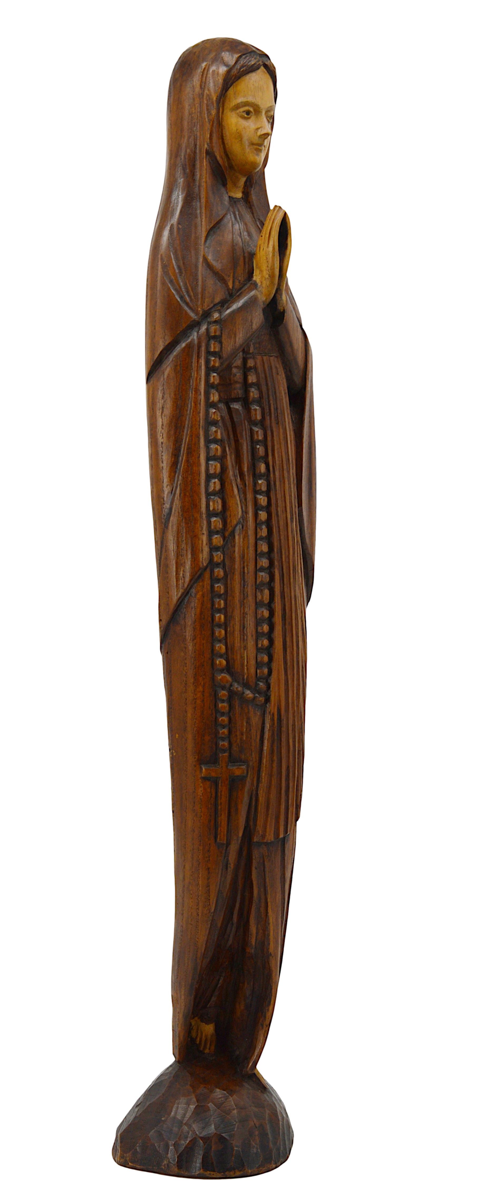 French Art Deco Madonna Holy Virgen statue, France, 1920s. Oak. Hand carved statue from what appears to be a single piece of oak. The size is important and the silhouette fine. It shows an elegance and a majesty becoming perfectly with the exception