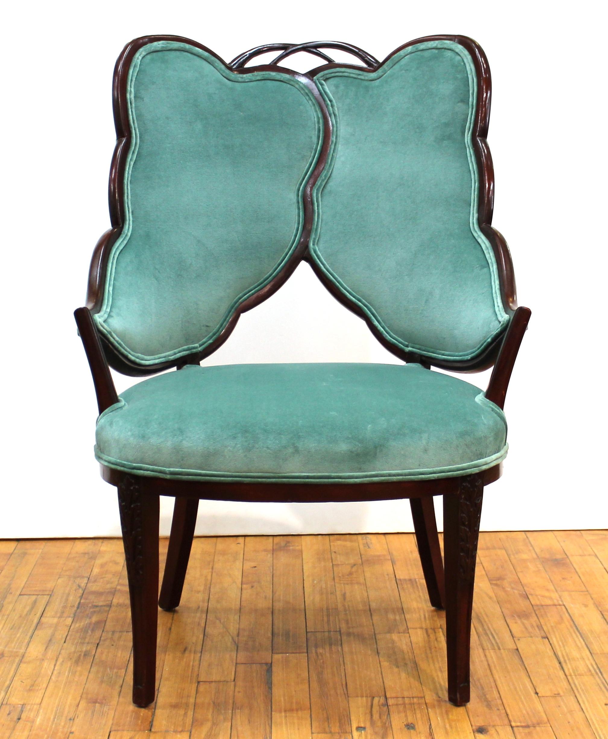 French pair of Art Deco chairs with a dramatic leaf design back. The frame is mahogany and has recently been reupholstered in a jade green velvet. In very good antique condition.