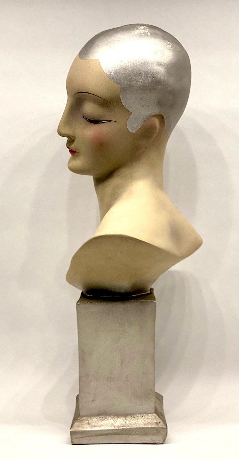 A stunning hand painted French Art Deco necklace and or hat display mannequin bust of a 1920s Flapper. Her expression is not only one of modest beauty, typical of the day, but also chic and stately. The eyes are open just a bit to show the iris. The