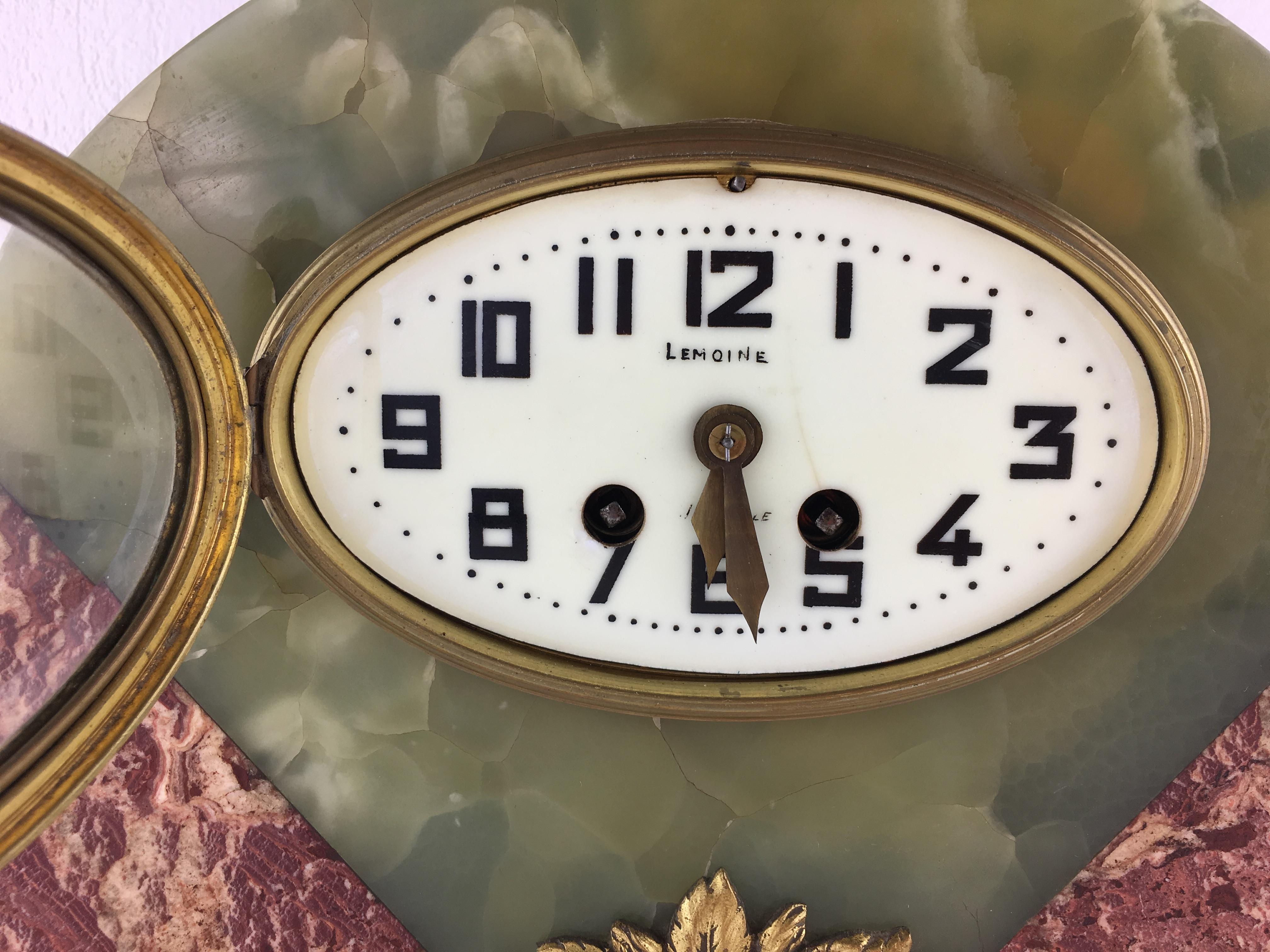 A stunning three piece French Art Deco Mantel Clock and garniture set with a fine French movement by and stamped Bennet & Pottier made in Paris, France. Finished on all sides, the stone quality and craftsmanship are of high quality.

Trendy green
