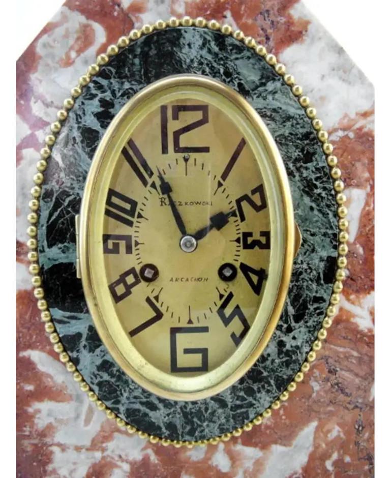 French Art Deco mantel clock set in the style of Sue & Mare, France, circa 1925. Marble, brass and glass. Measures: The clock height 11.8