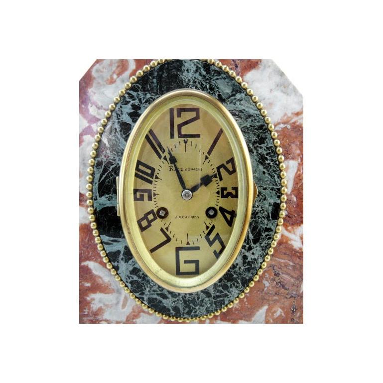 French Art Deco mantel clock set in the style of Sue & Mare, France, circa 1925. Marble, brass and glass. Measures: The clock height 11.8