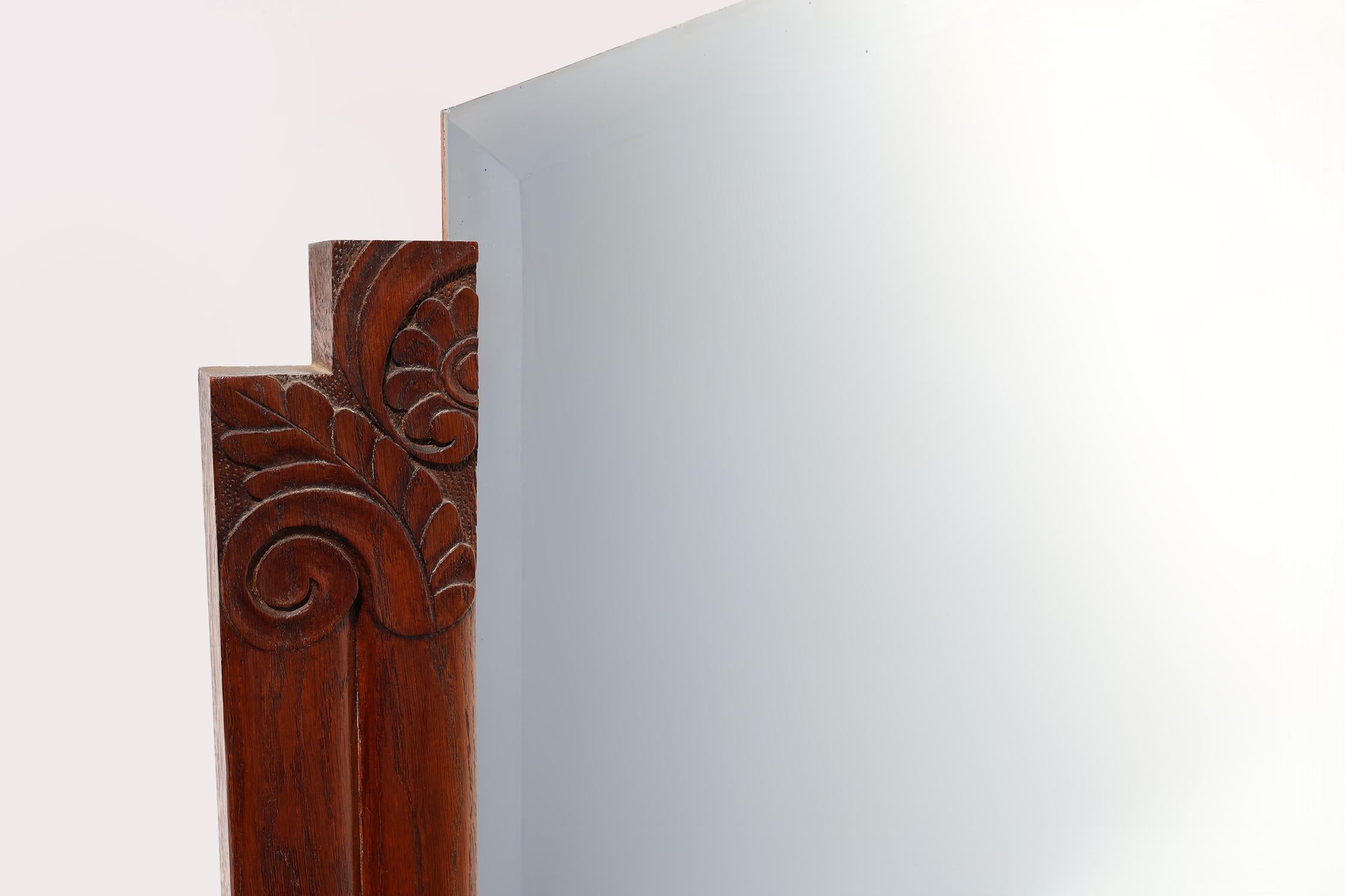 France / 1930 / Mantel Mirror / wood / Art Deco
 
Mantel Mirror with an Art Deco hand carved wooden frame and a facet cut mirror. Crafted in France in the 1930s. 

This mirror features a stunning wooden frame that exudes sophistication and warmth.