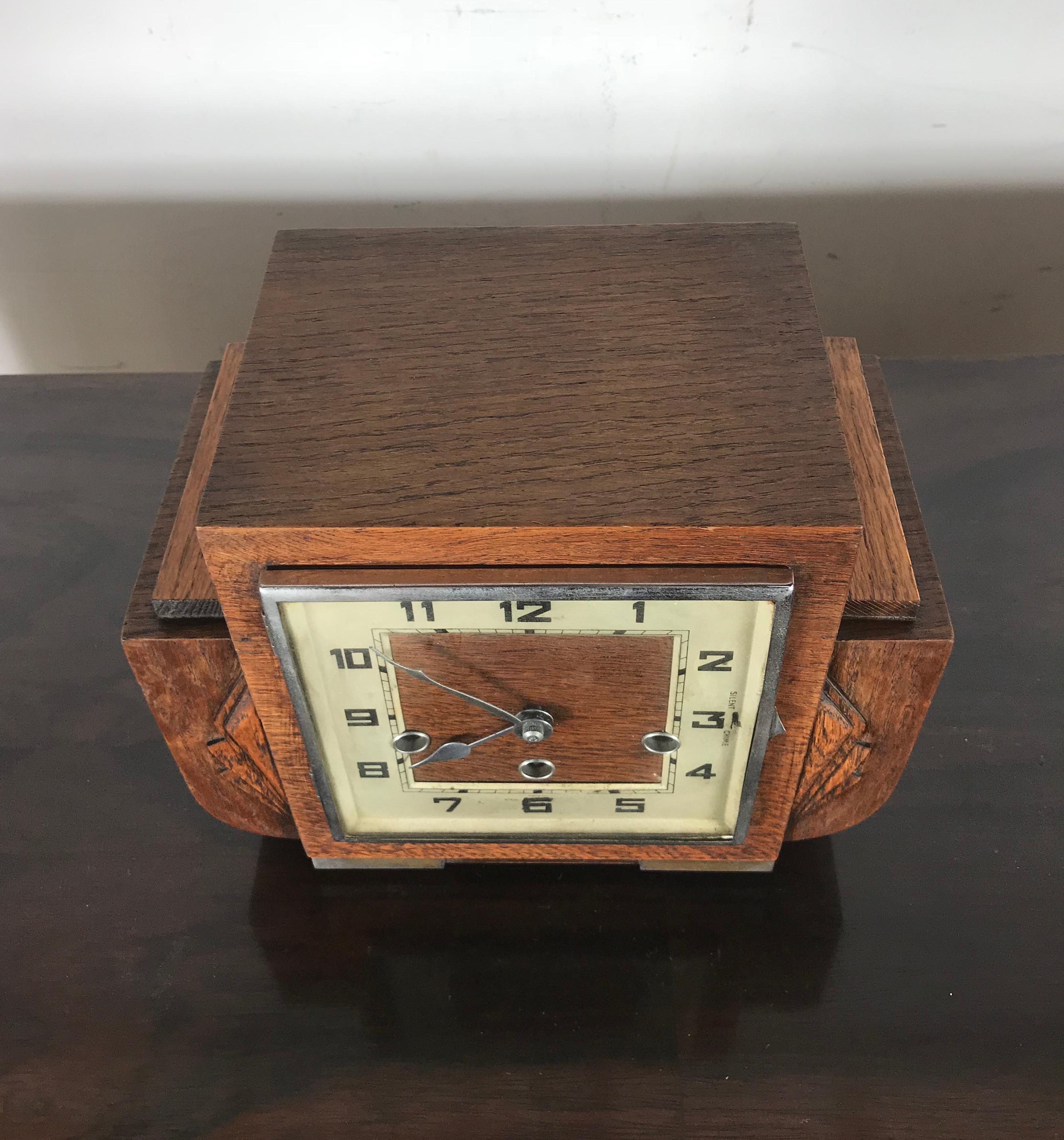French Art Deco mantel clock, 1930s. Beautiful mixed wood and style. Strikes every 15 minutes, in perfect working order.