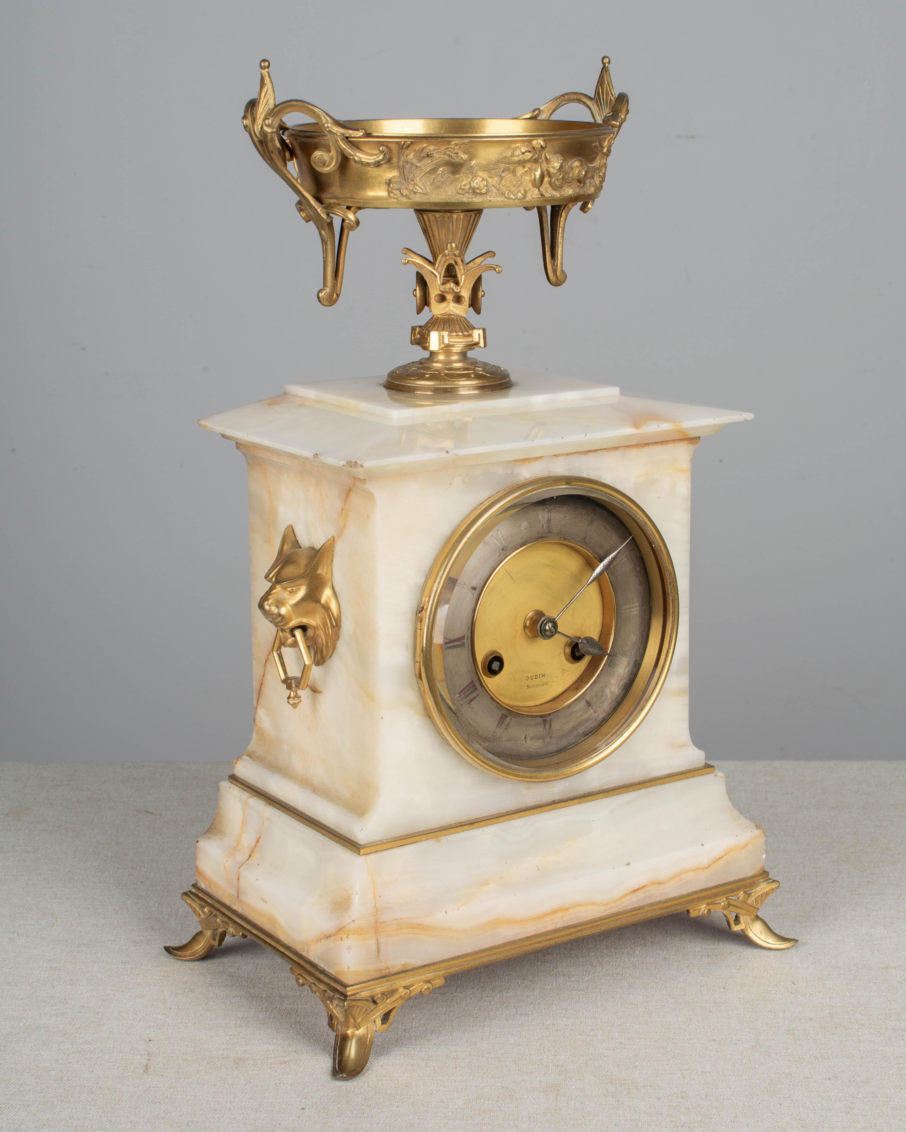 Cast French Art Deco Mantel Clock and Candelabras For Sale