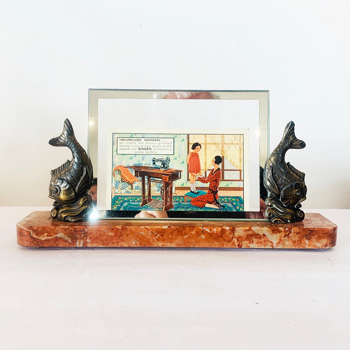 Art Deco photo frame with rouge red French marble base with carved quarter circles to both front edges, with Font D' arte fish holding the glass in bronze and silver tone finish. The glass is the original with a mirror edge to the front perimeter