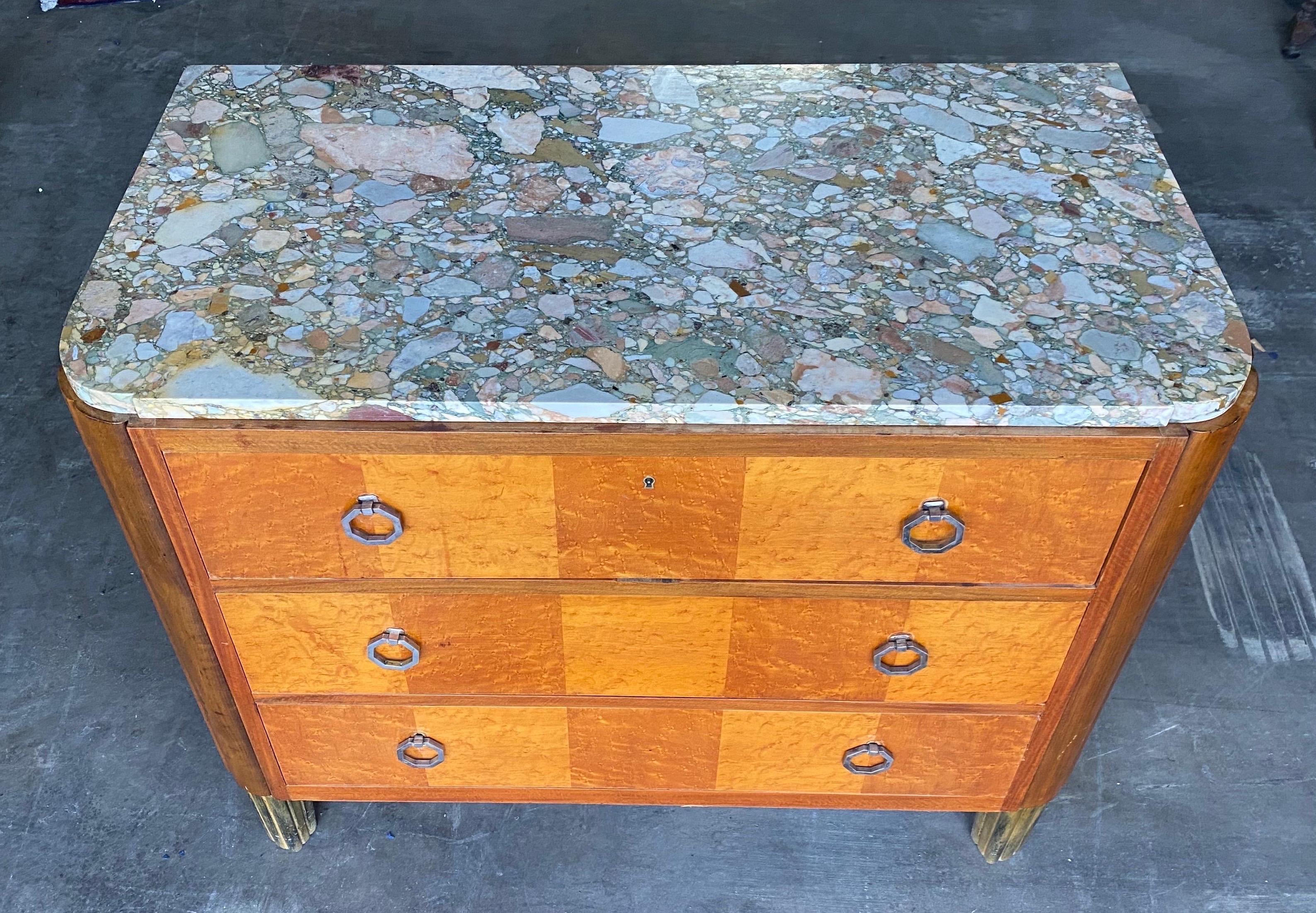 French art deco marble top 3 drawer chest on brass feet with key. Great inlay, heavily exaggerated reeded corners, shaped marble top. Very chic.