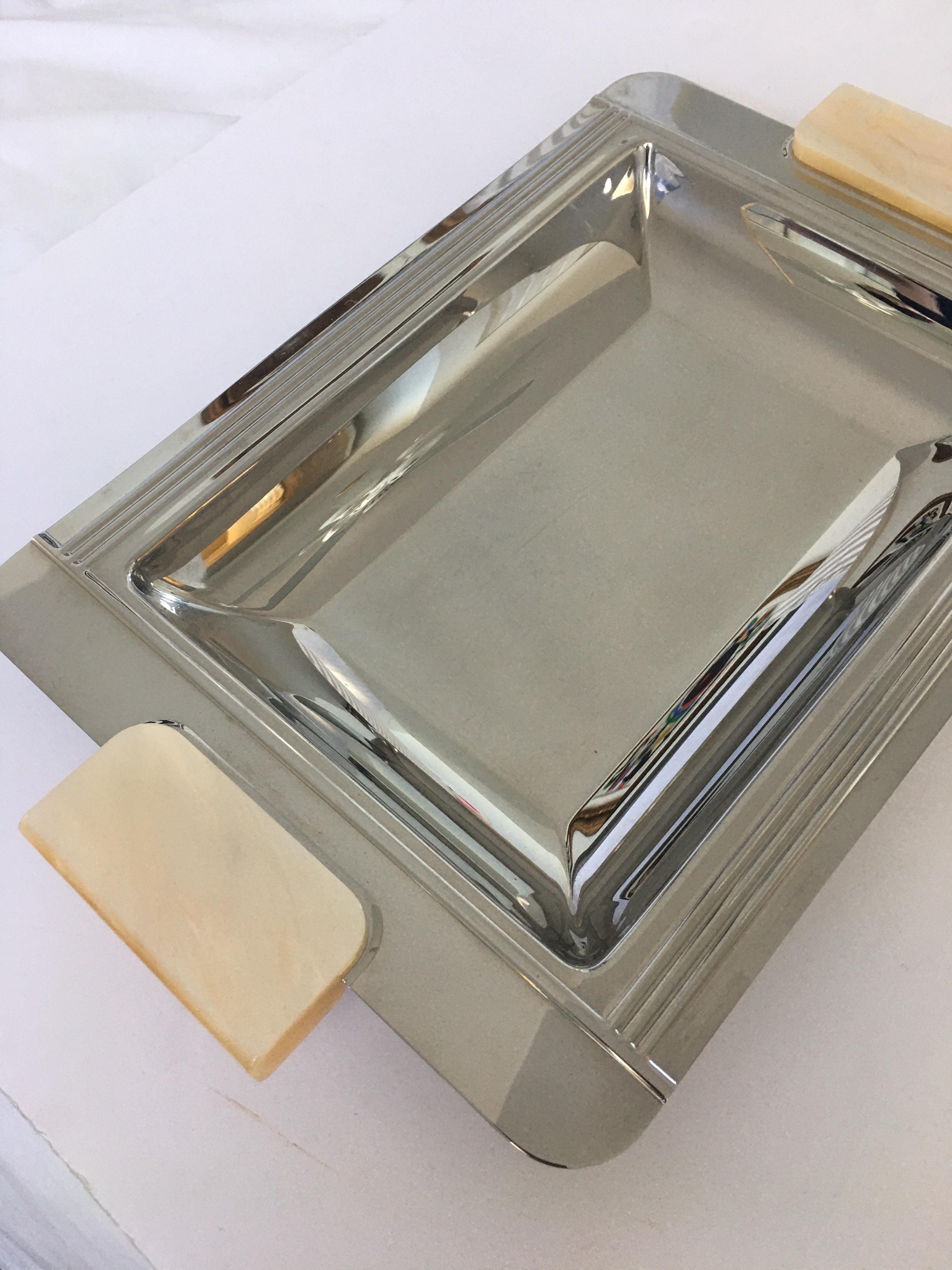 French Art Deco stainless steel serving tray by Couzon, France. This handsome rectangular tray features resin onyx or mother of pearl handles. A beautiful serving or bar ware tray.