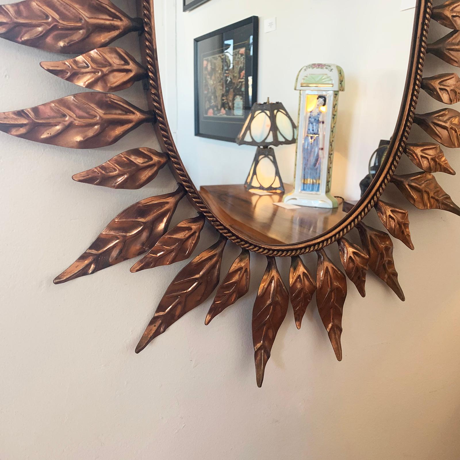 Art Deco oval mirror in pressed copper oak leaves design to the Perimeter, with a rolled copper edge to the mirror with an outer rope copper trim at inner edge of leaves. All in immaculate, original condition. Other than a couple of minor marks to