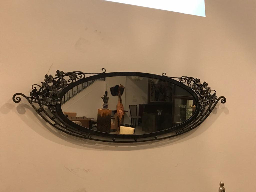 Stunning French Art Deco wrought iron floral mirror with beautiful Deco details. Can be re plated upon request. 
