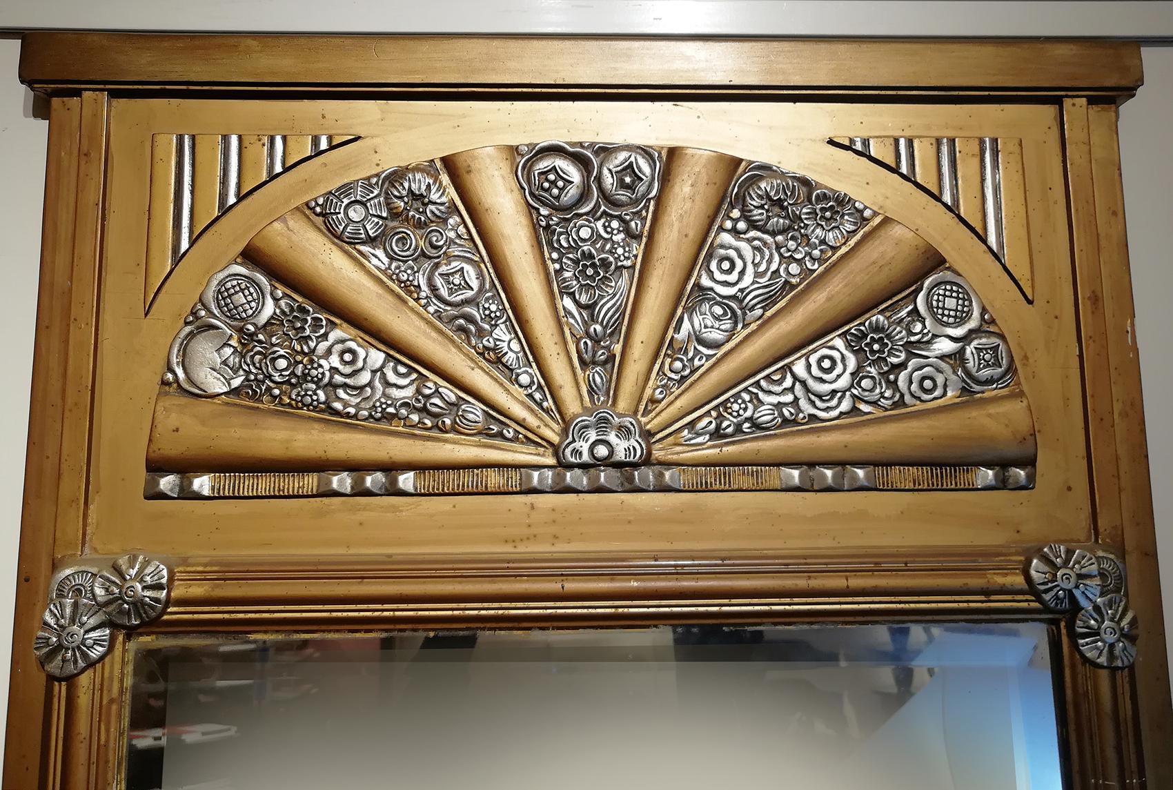 French Art Deco Mirror in gilded wood circa 1930 with beveled mirror showing a floral silver motif design on the upper side.