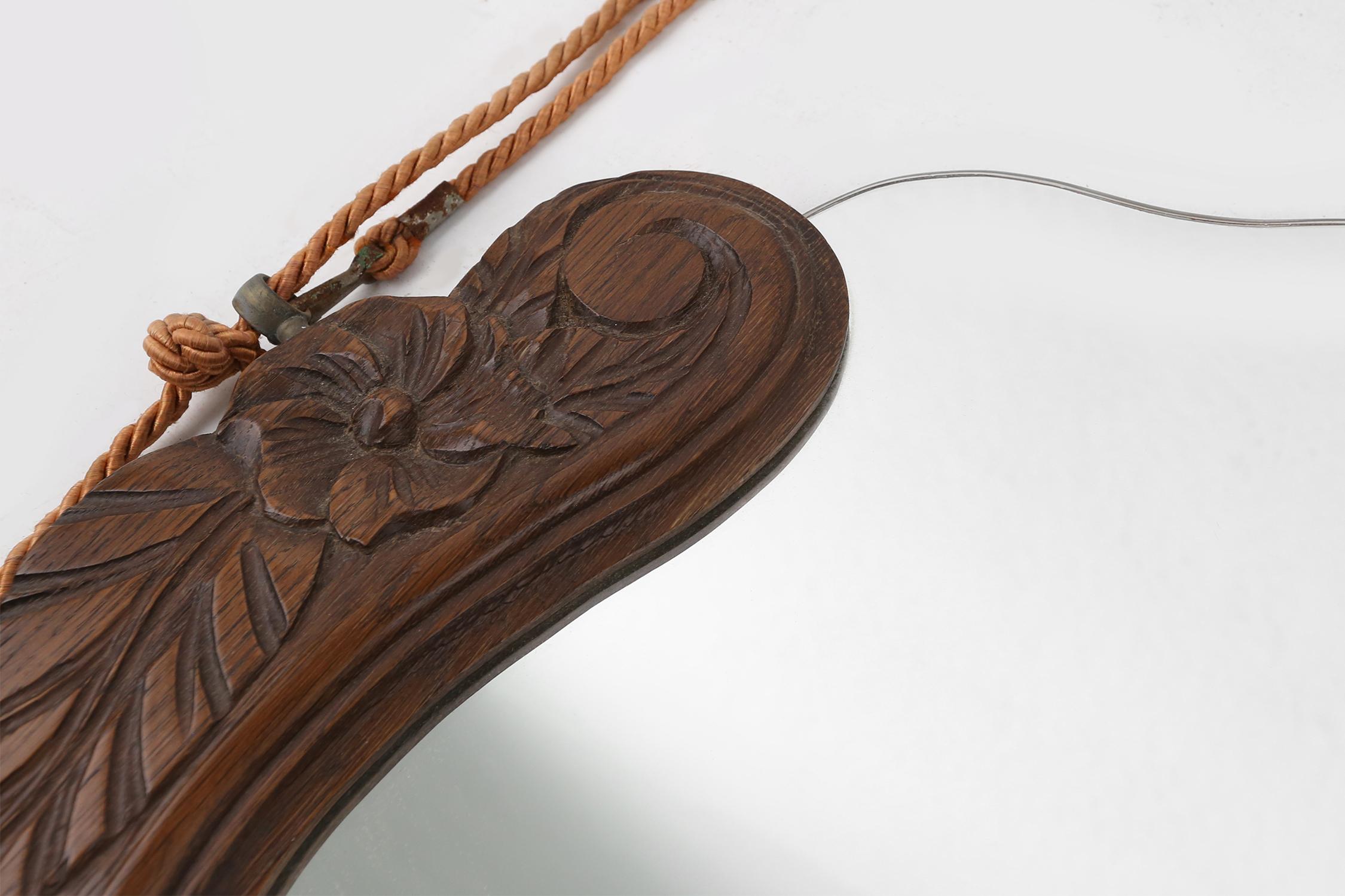 Mid-20th Century French Art Deco mirror in oak with floral carvings, 1940s