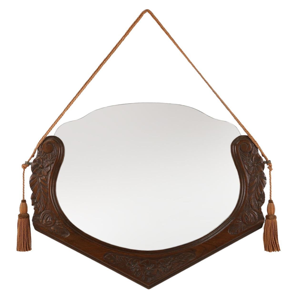 French Art Deco mirror in oak with floral carvings, 1940s