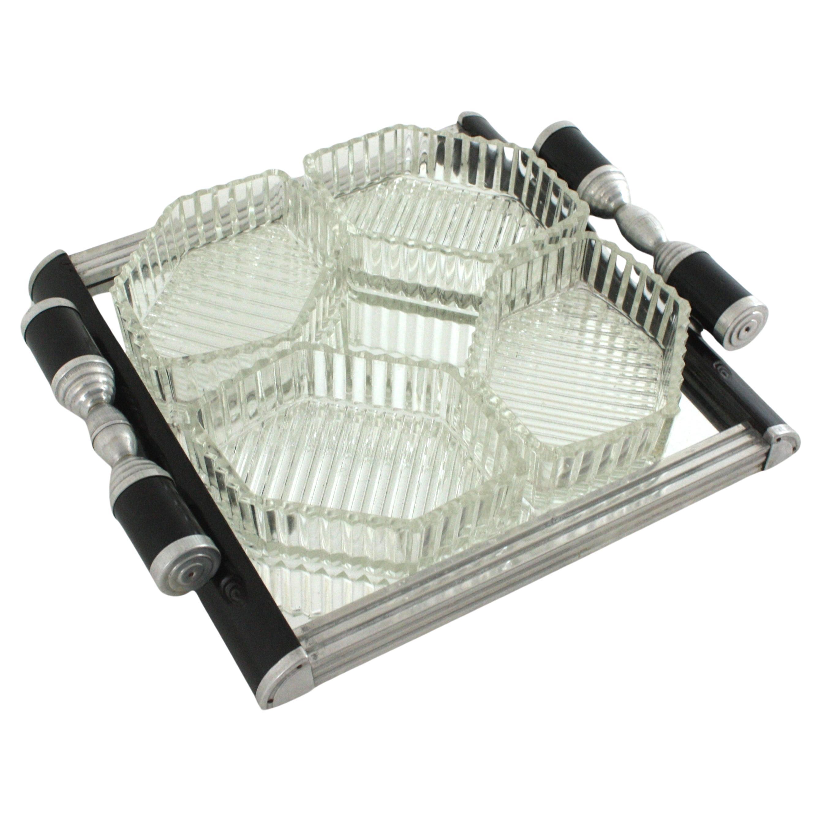 Eye-catching set of Black Lacquer Mirror Tray and Snacks Serving Bowls, France, 1930-1940.

This luxury set is comprised by: 
1 mirror tray with metal and black lacquered handles
4 pressed glass hexagonal bowls
On sale as a set of five pieces.

This