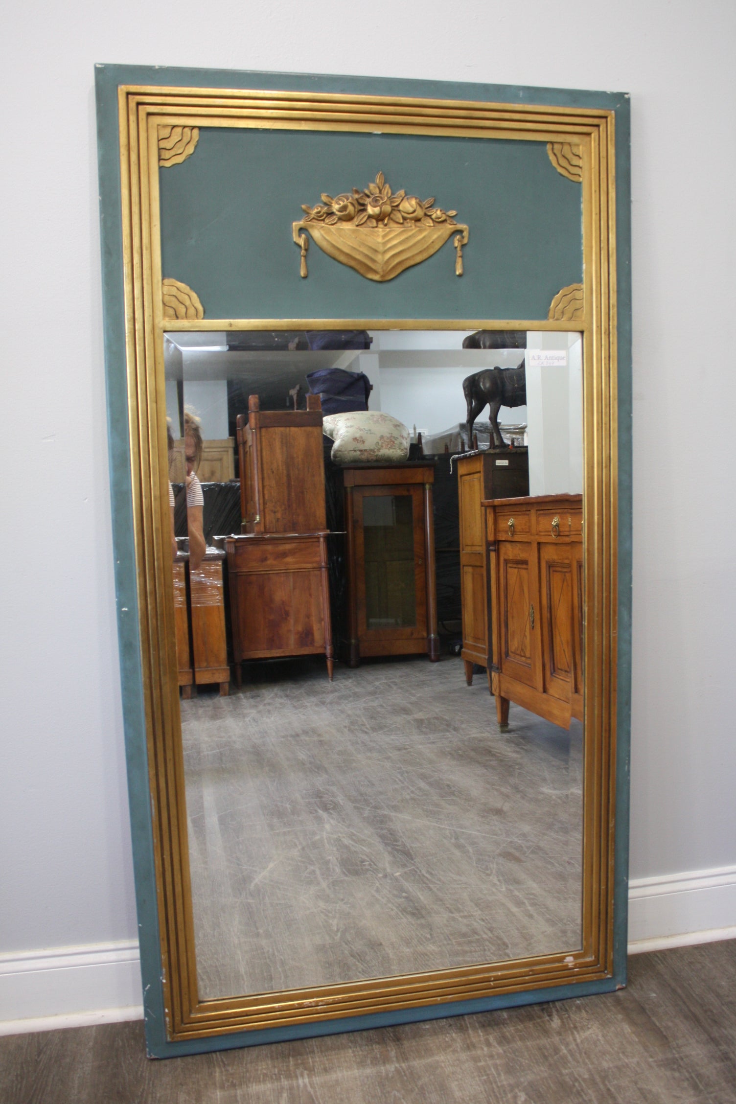 This Trumeau Mirror is covered of gilt leaves and painted. 