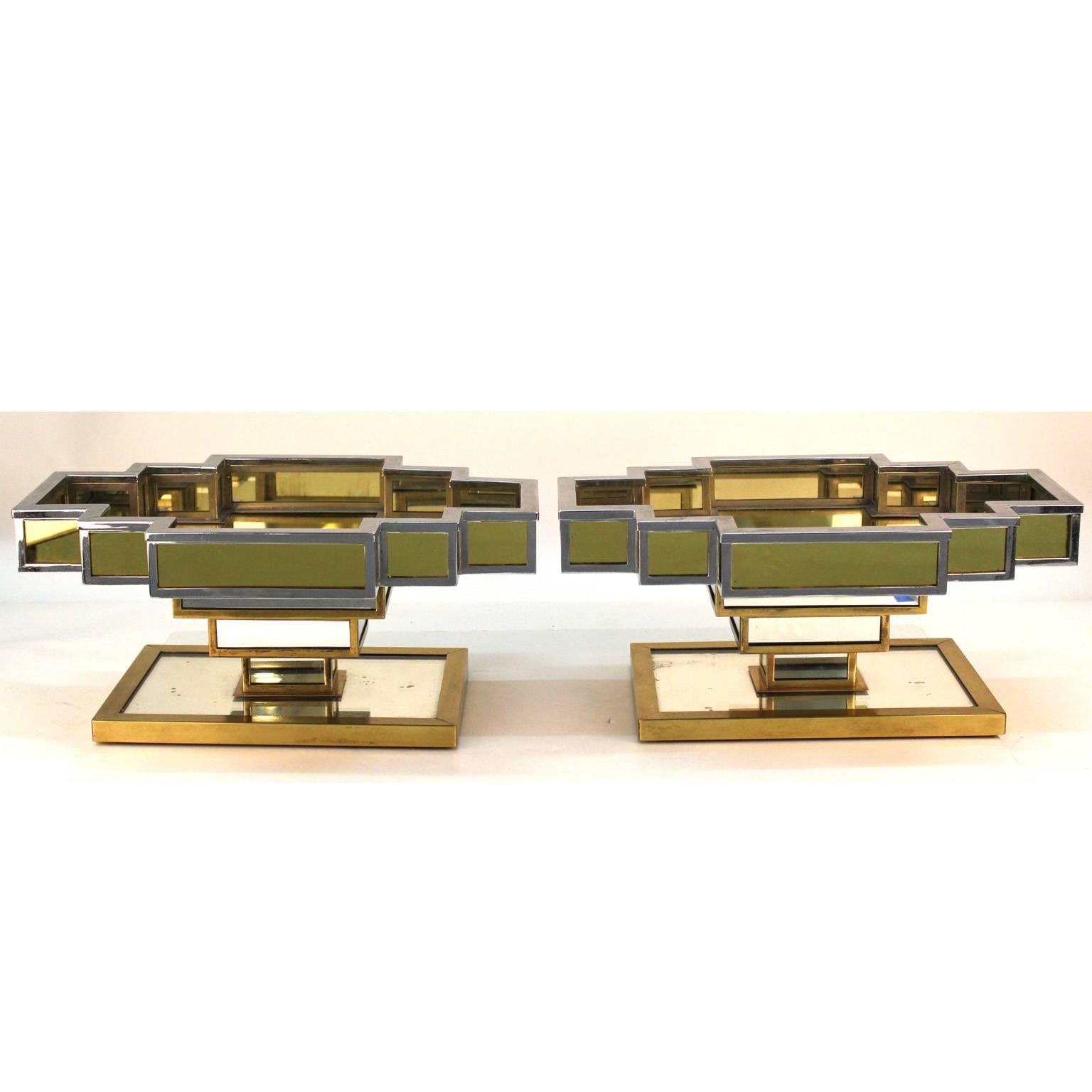 A pair of French Art Deco architectural centrepieces with amber and clear mirrored surfaces and a nickel on brass structure. Interesting architectural design with multi-faceted reflections. Very good original condition without chips.