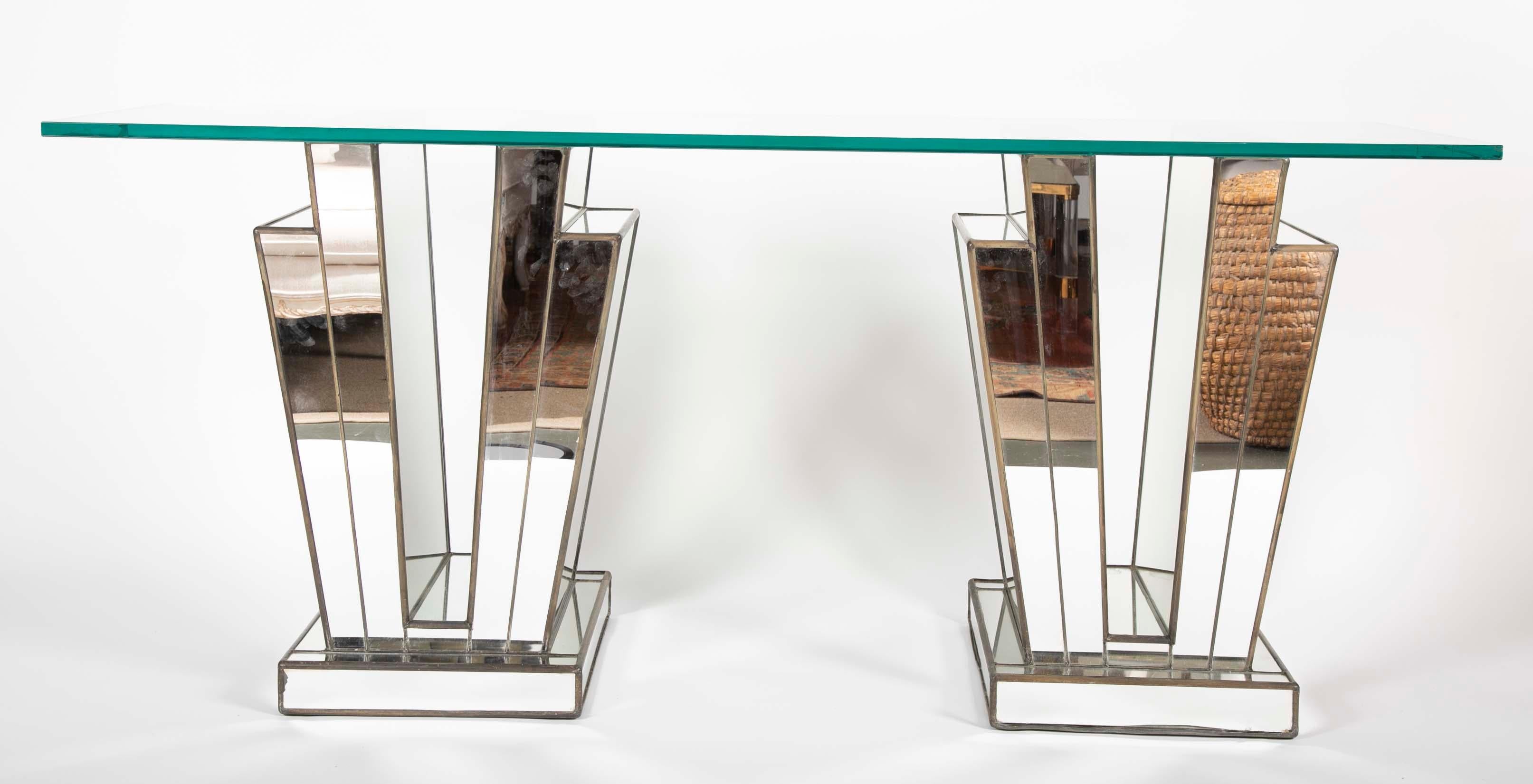 An interesting French mirrored glass Art Deco console table with glass top and lead trim.