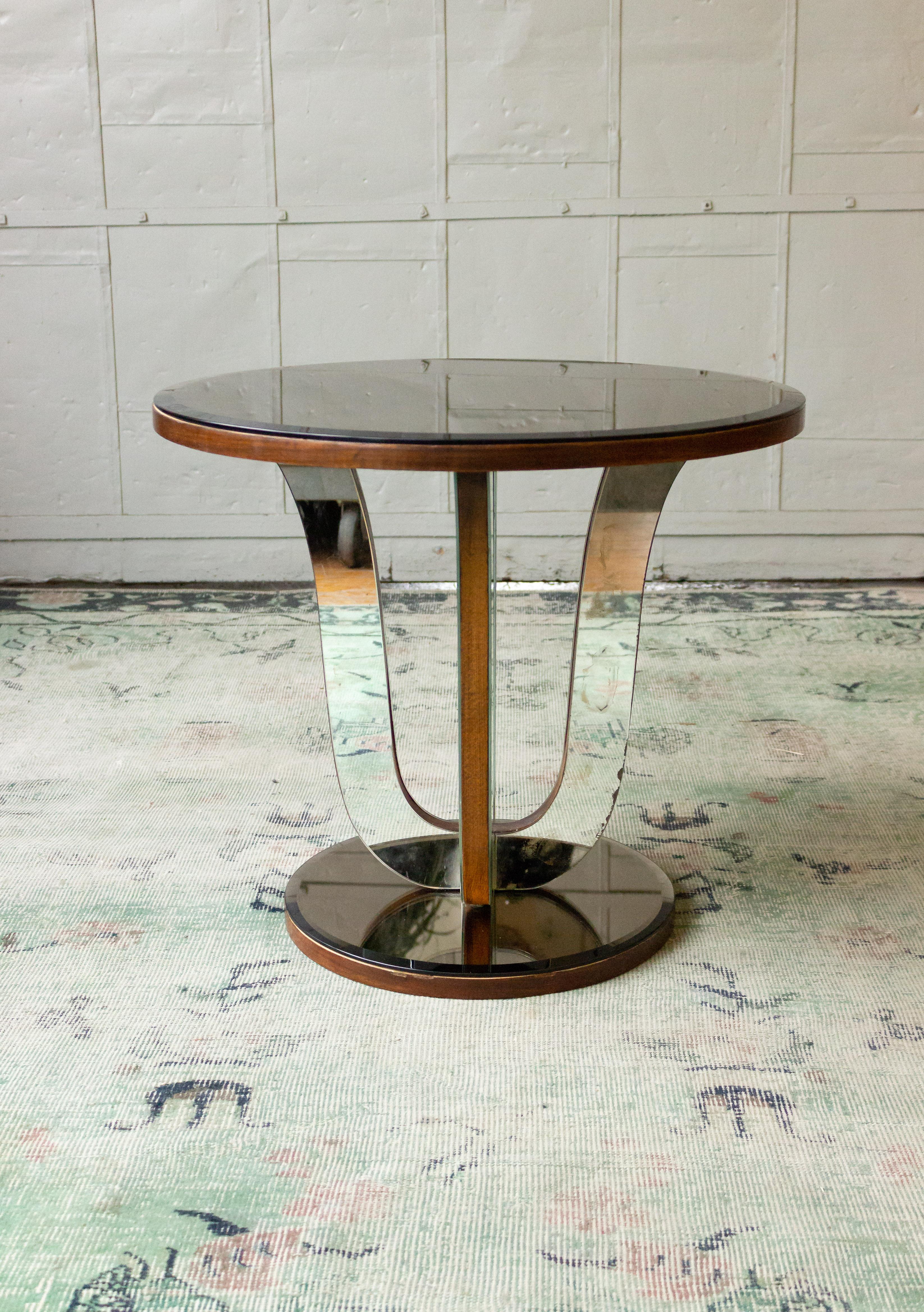 French Art Deco walnut end table. Original mirror remains on the legs while both the top and base have been replaced with a grey beveled mirror. 


