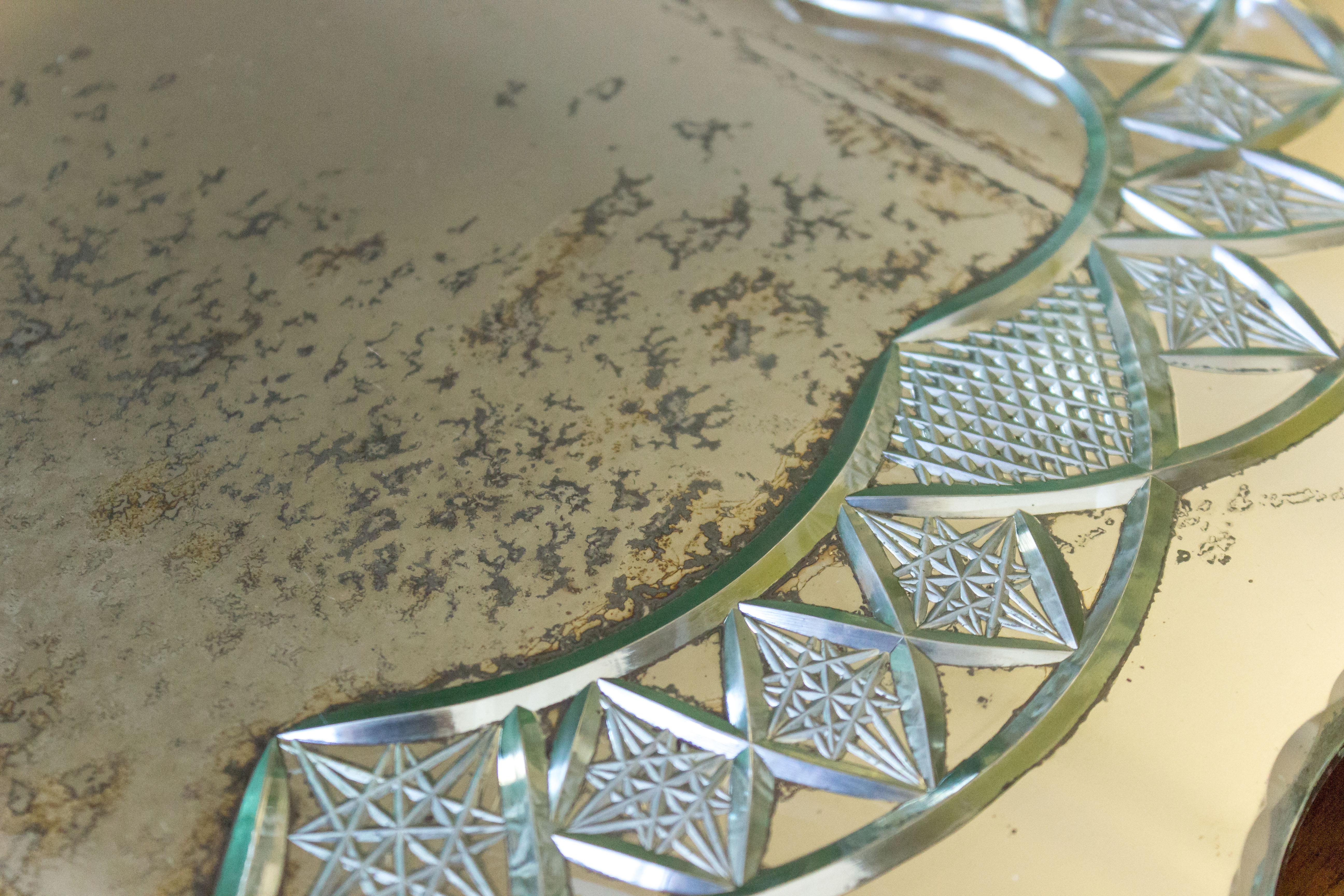 French 1920s etched mirror serving tray with scalloped edges and nickel handles. Very special piece with age quite visible. No chips or damage to tray.

Ref #: D1218-01

Dimensions: 2.5
